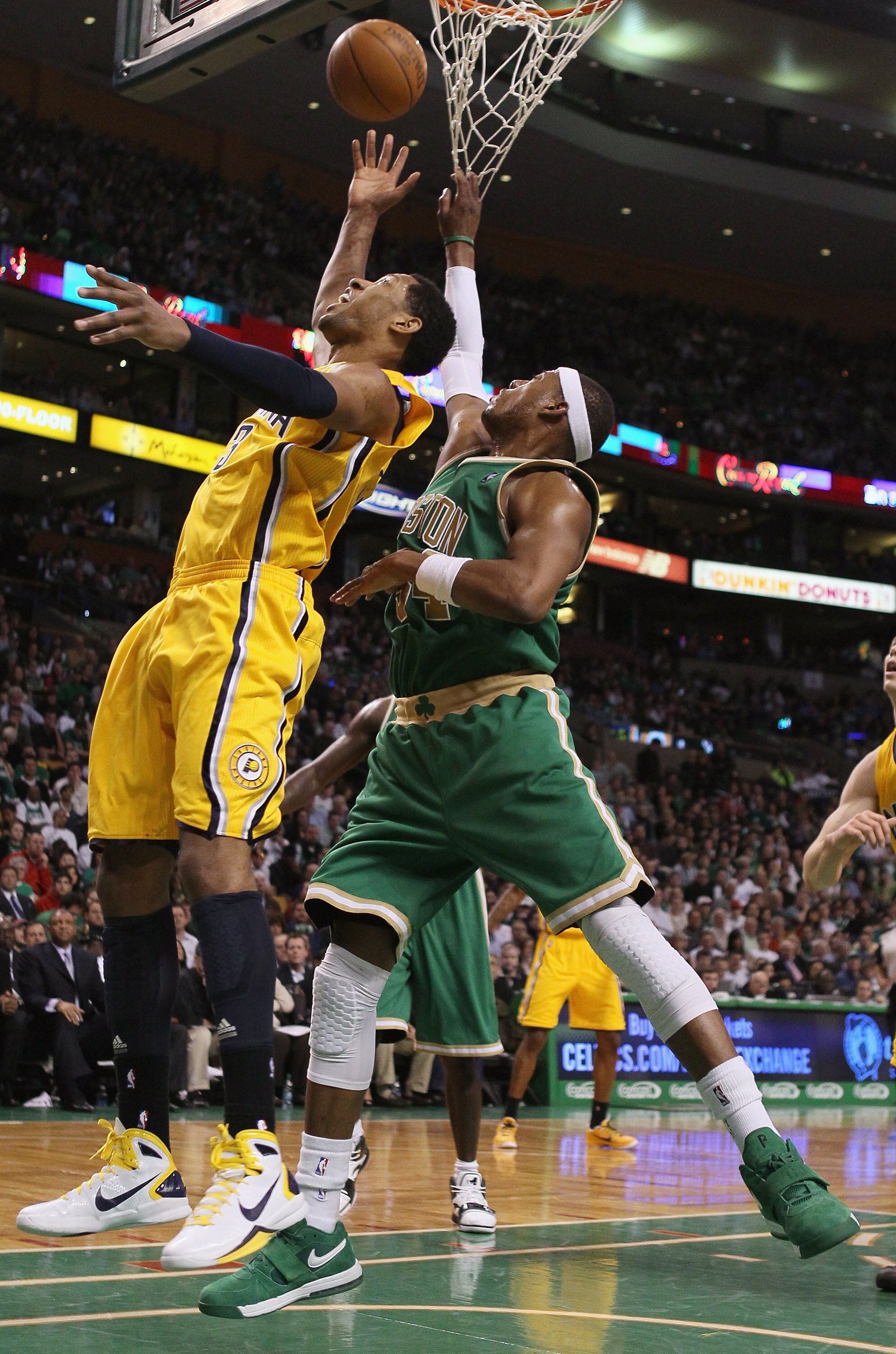 BOSTON, MA - MARCH 16:  Danny Granger #33 of the Indiana Pacers takes a shot as Paul Pierce #34 of the Boston Celtics defends on March 16, 2011 at the TD Garden in Boston, Massachusetts. The Celtics defeated the Indiana Pacers 92-80. NOTE TO USER: User ex