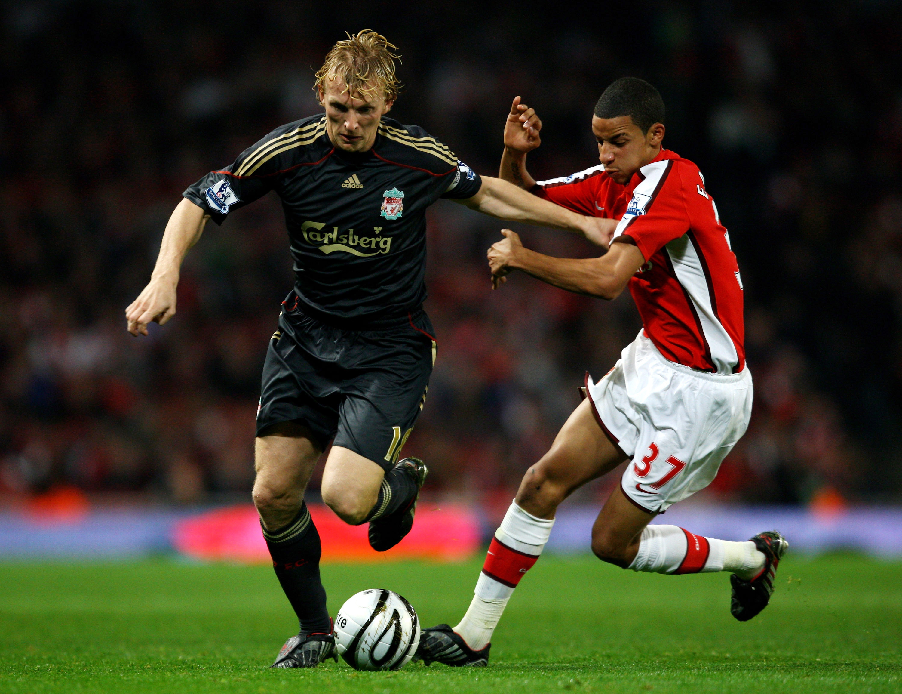 LONDON, ENGLAND - OCTOBER 28:  Dirk Kuyt of Liverpool is challenged by Craig Eastmond of Arsenal during the Carling Cup 4th Round match between Arsenal and Liverpool at the Emirates Stadium on October 28, 2009 in London, England.  (Photo by Shaun Botteril