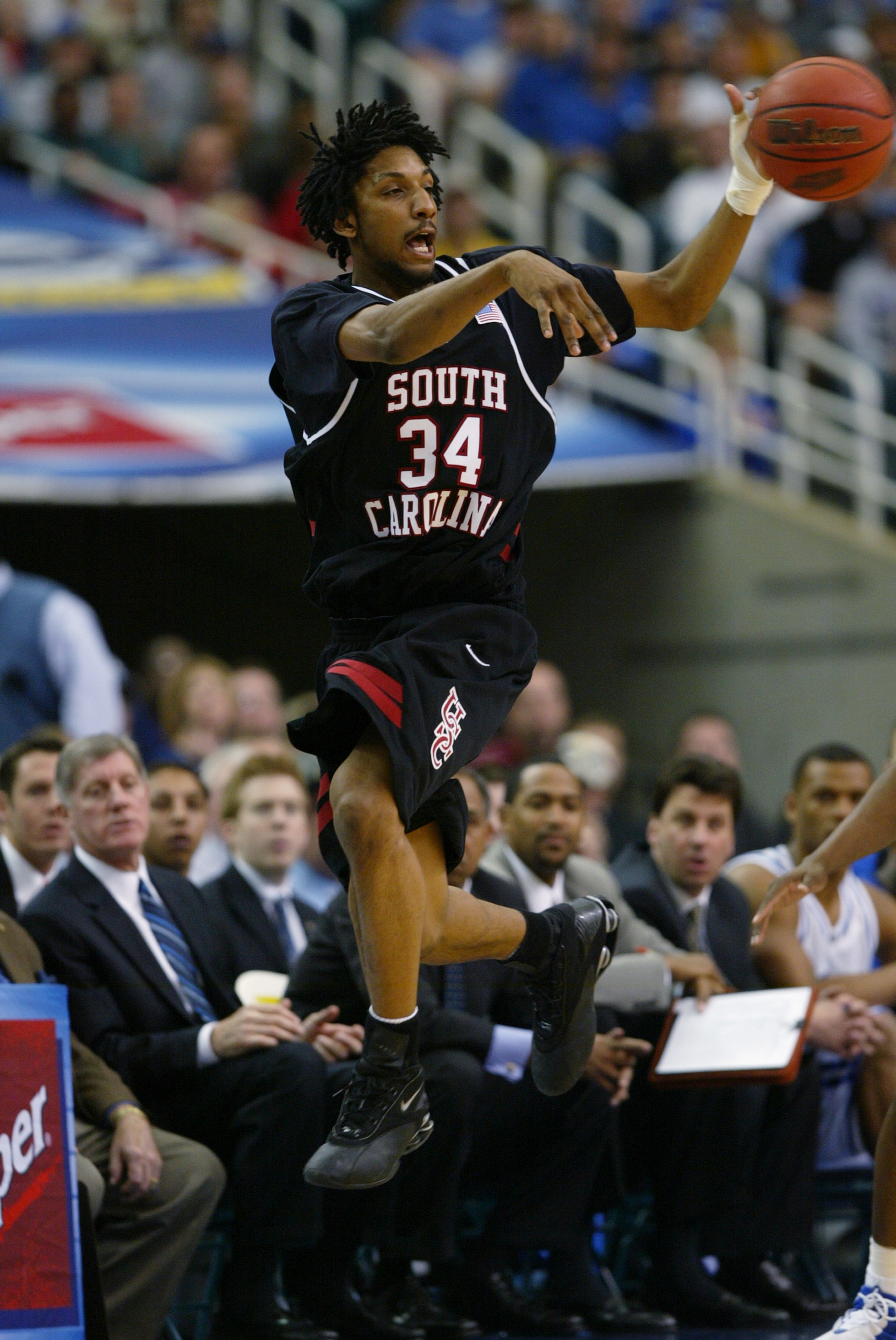 ATLANTA - MARCH 13:  Renaldo Balkman #34 of the South Carolina Gamecocks passes while in mid air during the SEC Men's Basketball Tournament semifinals game against the Kentucky Wildcats on March 13, 2004 at the Georgia Dome in Atlanta, Georgia.  Kentucky
