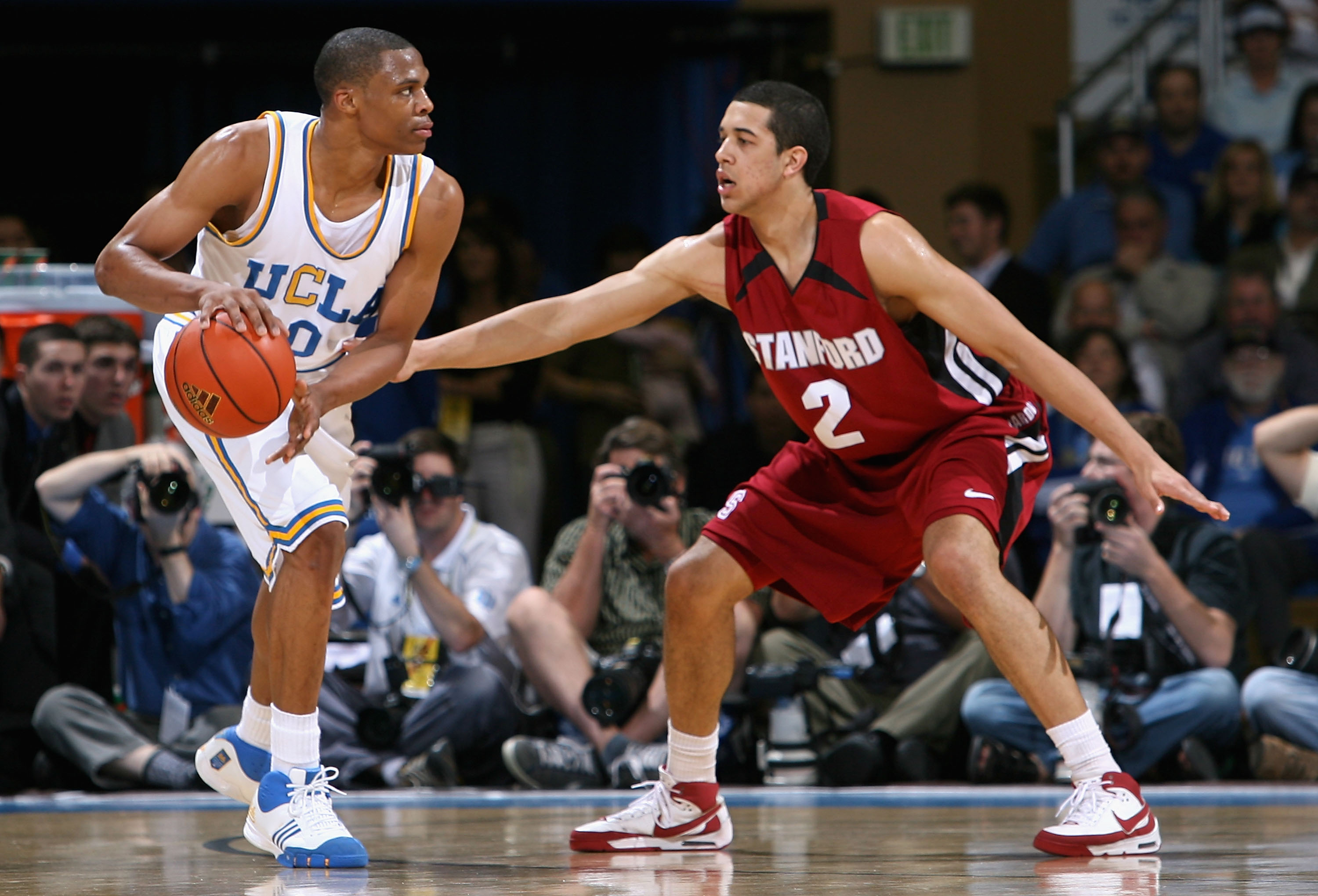 WESTWOOD, CA - MARCH 06:  Russell Westbrook #0 of the UCLA Bruins handles the ball under pressure from Landry Fields #2 of the Stanford Cardinals during the college basketball game at Pauley Pavilion on March 6, 2008 in Westwood, California.  (Photo by Ch
