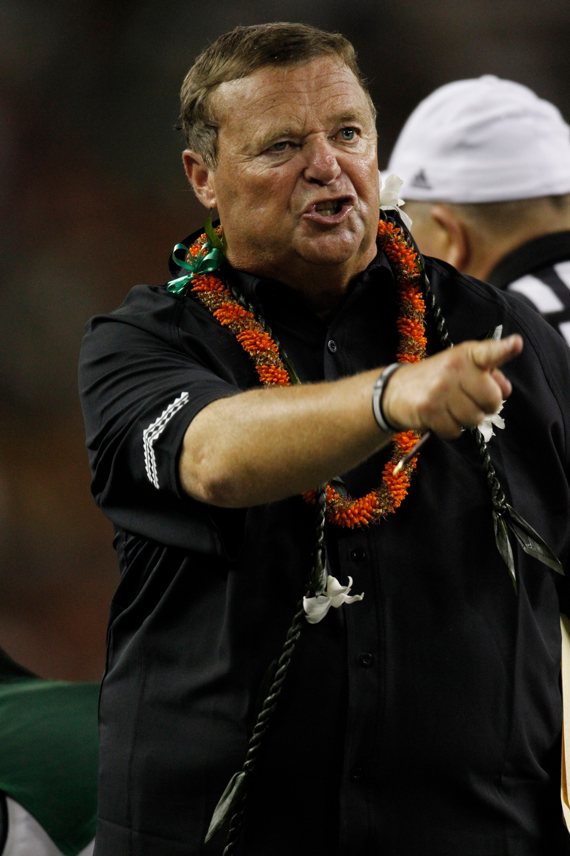 HONOLULU - SEPTEMBER 2:  Head Coach Greg McMackin of the University of Hawaii Warriors exchanges words with game officials during second half action at Aloha Stadium September 2, 2010 in Honolulu, Hawaii. (Photo by Kent Nishimura/Getty Images)