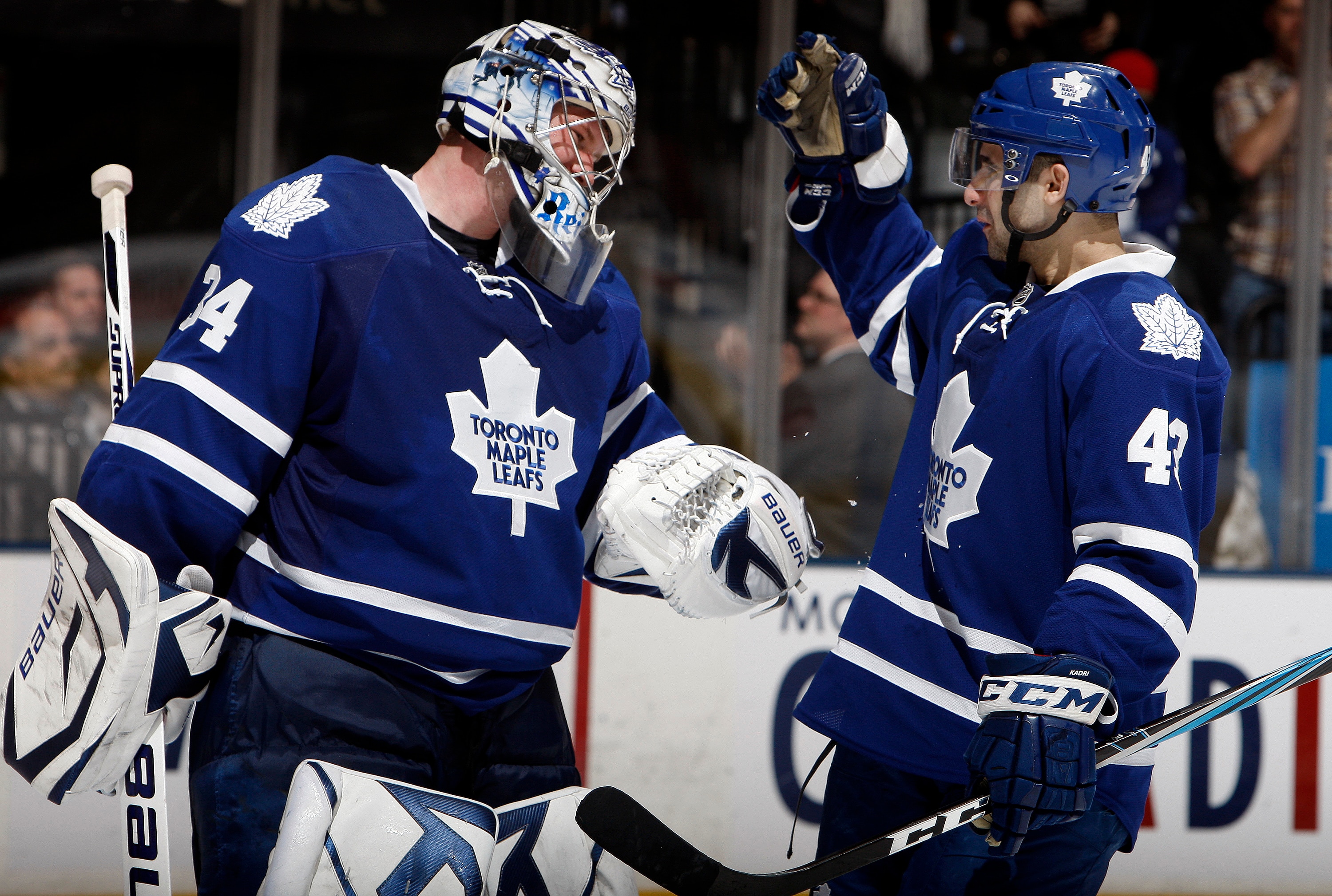 TORONTO, CANADA - MARCH 19  James Reimer #34 and Nazem Kadri #43 of the Toronto Maple Leafs celebrate 5-2 win over the Boston Bruins during game action at the Air Canada Centre March 19, 2011 in Toronto, Ontario, Canada. (Photo by Abelimages/Getty Images)