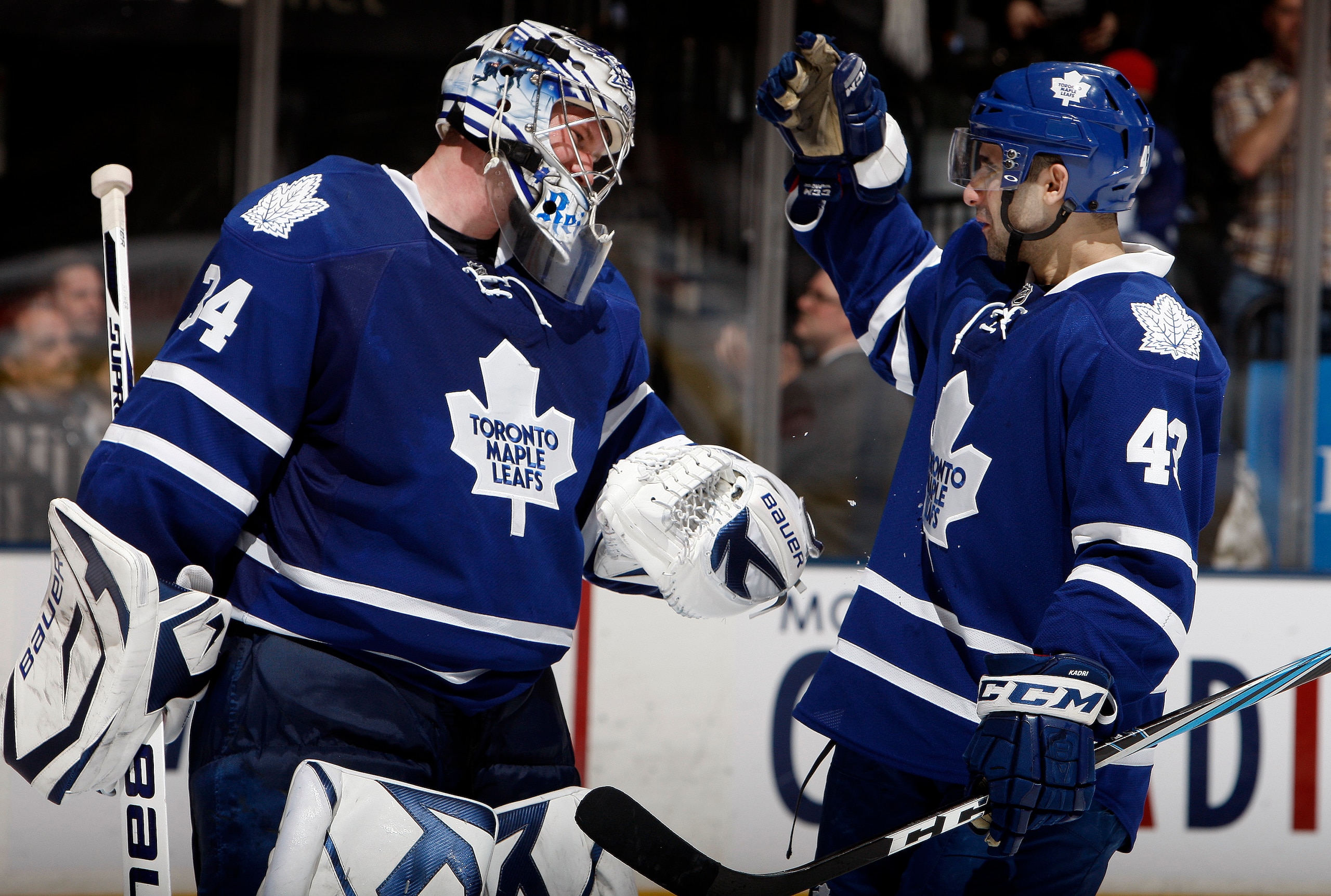 TORONTO, CANADA - MARCH 19  James Reimer #34 and Nazem Kadri #43 of the Toronto Maple Leafs celebrate 5-2 win over the Boston Bruins during game action at the Air Canada Centre March 19, 2011 in Toronto, Ontario, Canada. (Photo by Abelimages/Getty Images)