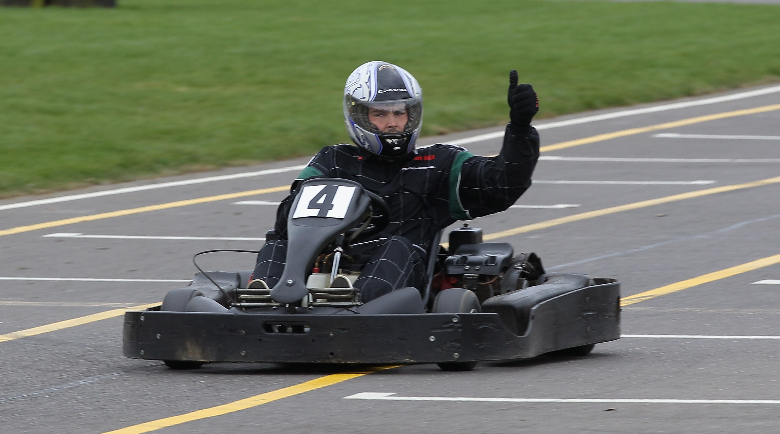 NORTHAMPTON, ENGLAND - MARCH 21:  Ben Foden, the Northampton Saints and England fullback gives the thumbs up whilst driving on a go-kart  during the Northampton Saints media day on March 21, 2011 in Northampton, England.  (Photo by David Rogers/Getty Imag
