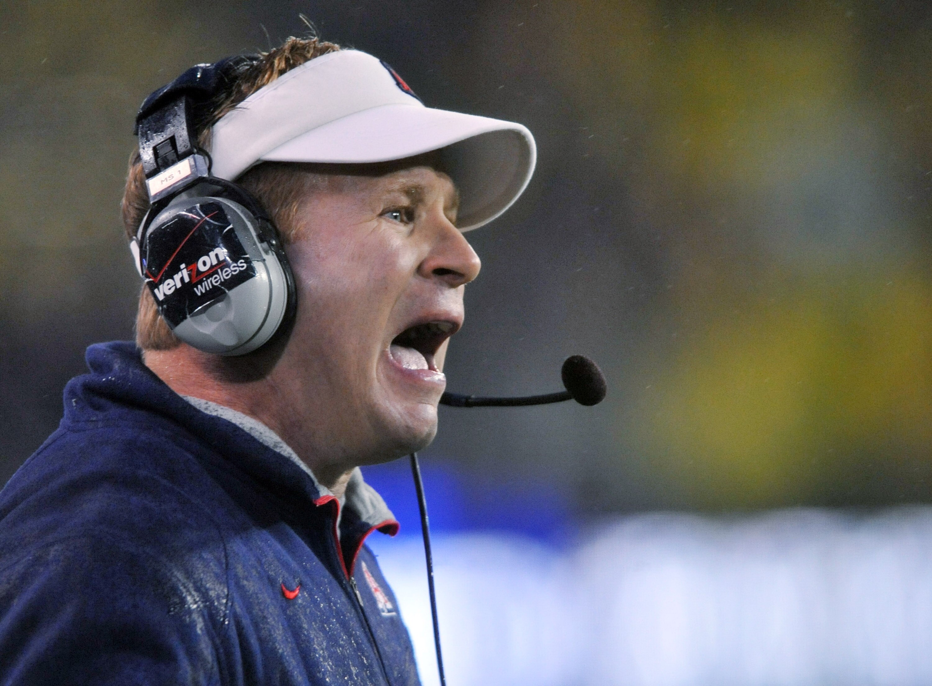 EUGENE, OR - NOVEMBER 26: Head coach Mike Stoops of the Arizona Wildcats yells out to his team in the first quarter of the game against the Oregon Ducks at Autzen Stadium on November 26, 2010 in Eugene, Oregon.The Ducks won the game 48-29. (Photo by Steve