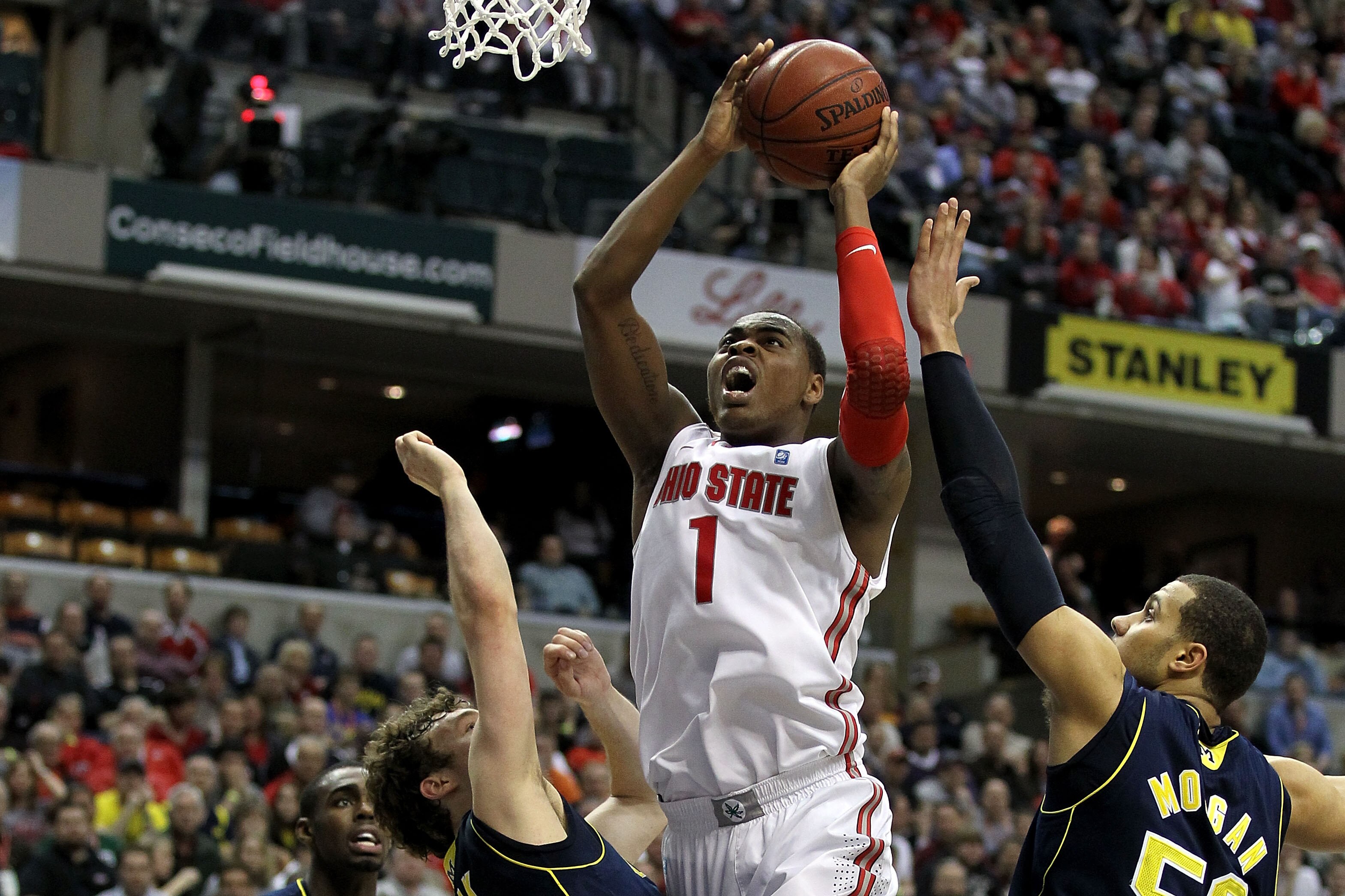 INDIANAPOLIS, IN - MARCH 12:  Deshaun Thomas #1 of the Ohio State Buckeyes drives for a shot attempt against the Michigan Wolverines during the semifinals of the 2011 Big Ten Men's Basketball Tournament at Conseco Fieldhouse on March 12, 2011 in Indianapo