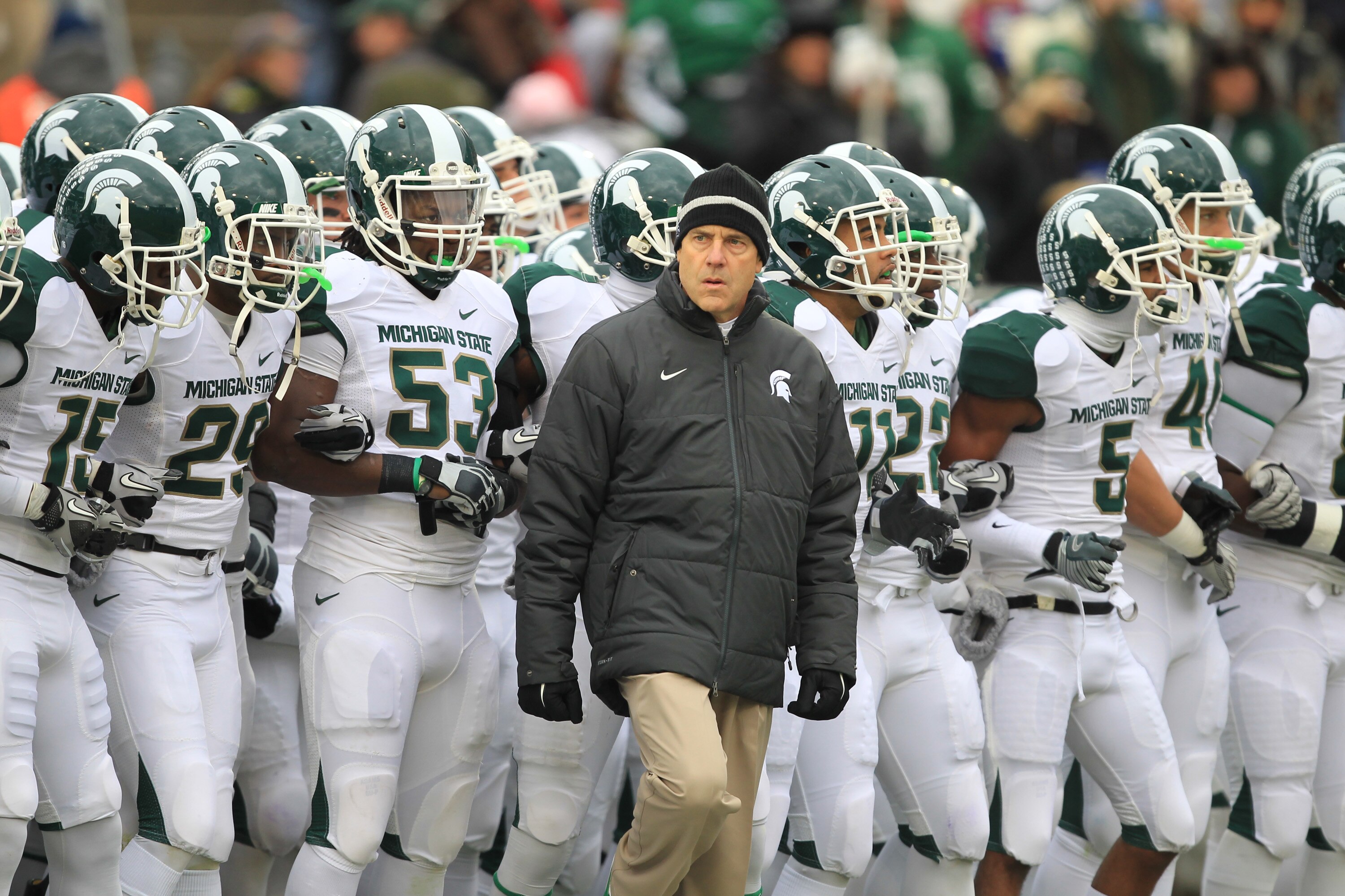 STATE COLLEGE, PA - NOVEMBER 27: Head coach Mark Dantonio of the Michigan State Spartans leads his team onto the field before a game against the Penn State Nittany Lions on November 27, 2010 at Beaver Stadium in State College, Pennsylvania. The Spartans w