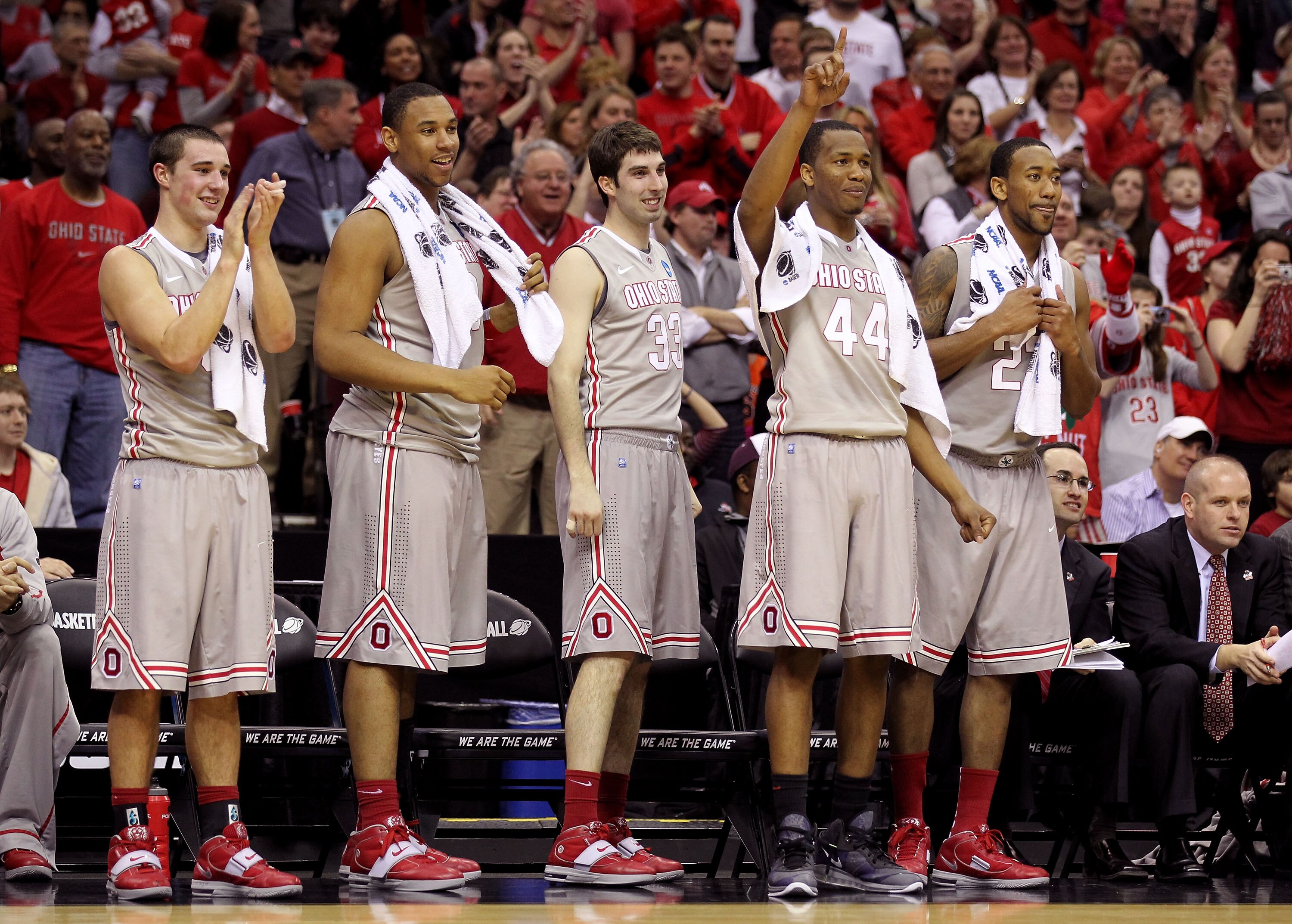 CLEVELAND, OH - MARCH 20:  Aaron Craft #4, Jared Sullinger #0, Jon Diebler #33, William Buford #44 and David Lighty #23 of the Ohio State Buckeyes look on from the bench late in the second half against the George Mason Patriots during the third of the 201