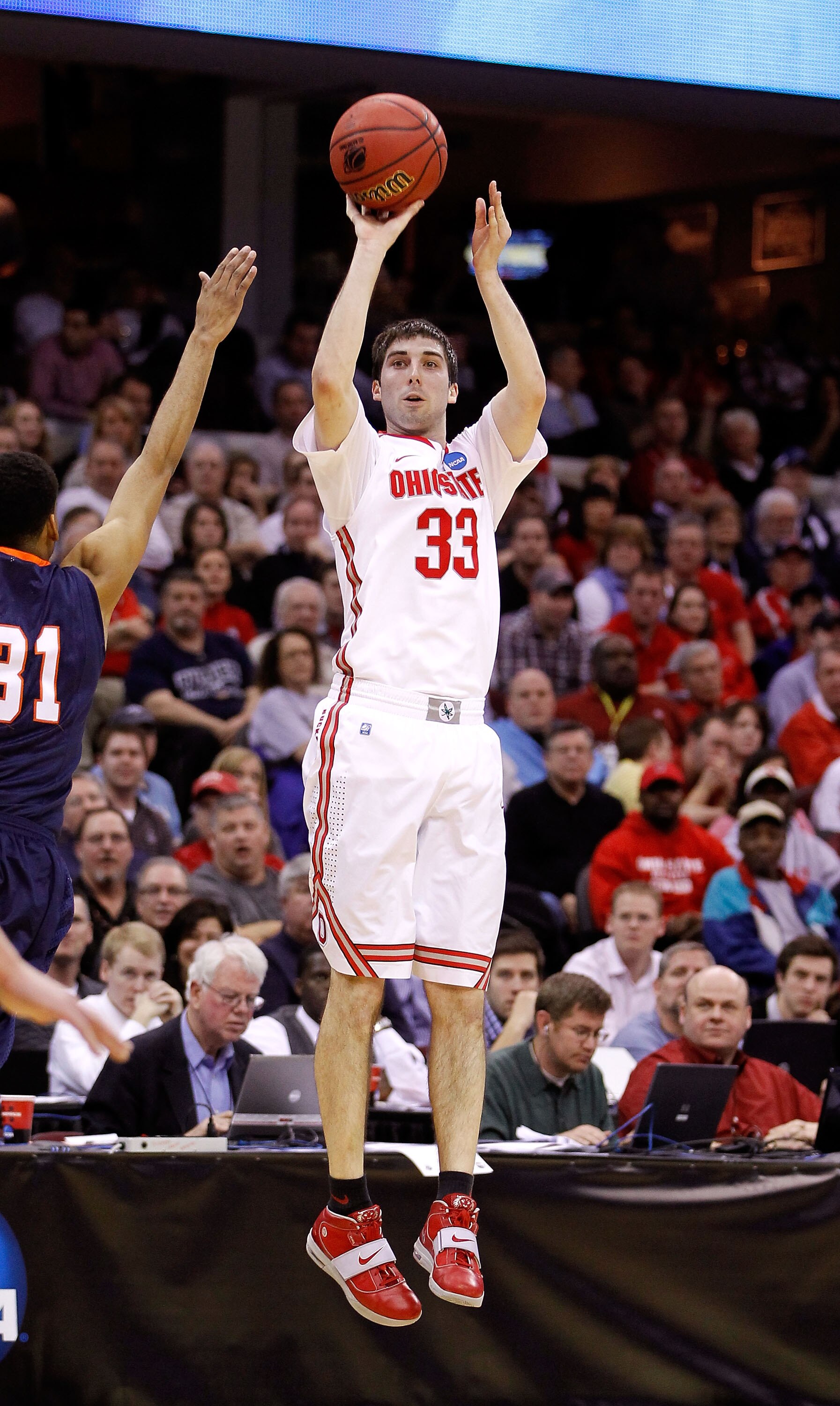 CLEVELAND, OH - MARCH 18: Jon Diebler #33 of the Ohio State Buckeyes shoots against Melvin Johnson III #31 of the Texas-San Antonio Roadrunners during the second round of the 2011 NCAA men's basketball tournament at Quicken Loans Arena on March 18, 2011 i