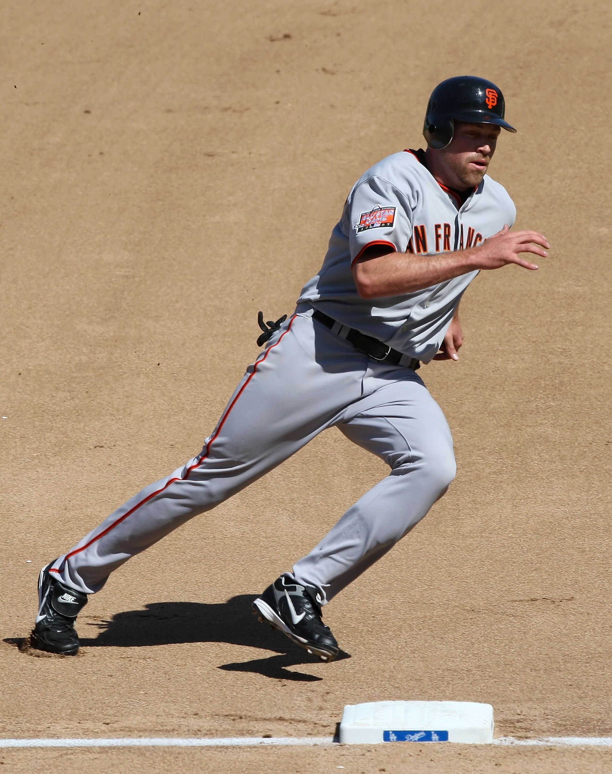 LOS ANGELES, CA - SEPTEMBER 30:   Nate Schierholtz #12 of the San Francisco Giants runs the bases to score in the fourth inning against the Los Angeles Dodgers at Dodger Stadium on September 30, 2007 in Los Angeles, California.  (Photo by Lisa Blumenfeld/