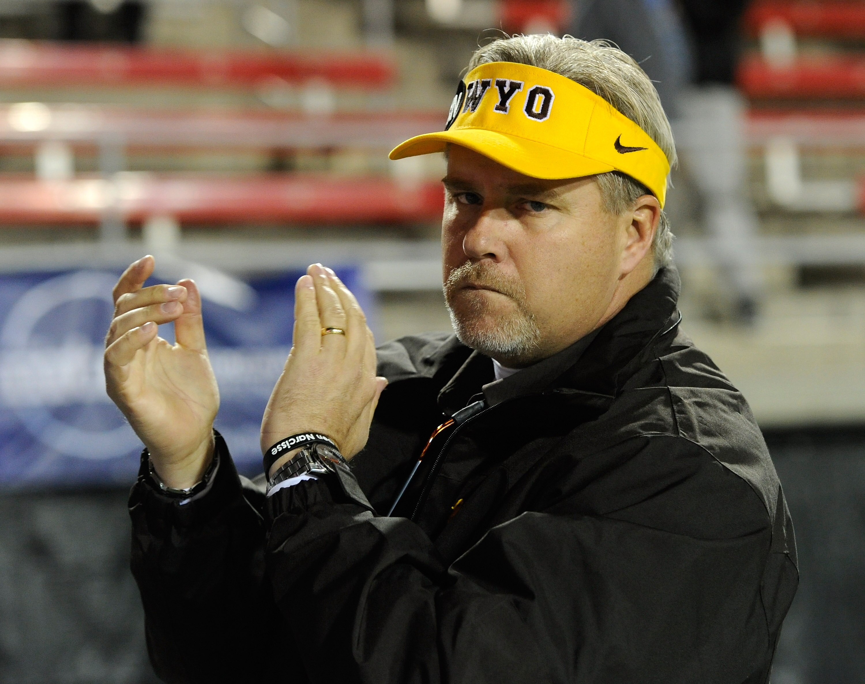 LAS VEGAS - NOVEMBER 13:  Head coach Dave Christensen of the Wyoming Cowboys claps as his team takes the field for a game against the UNLV Rebels at Sam Boyd Stadium November 13, 2010 in Las Vegas, Nevada. UNLV won 42-16.  (Photo by Ethan Miller/Getty Ima