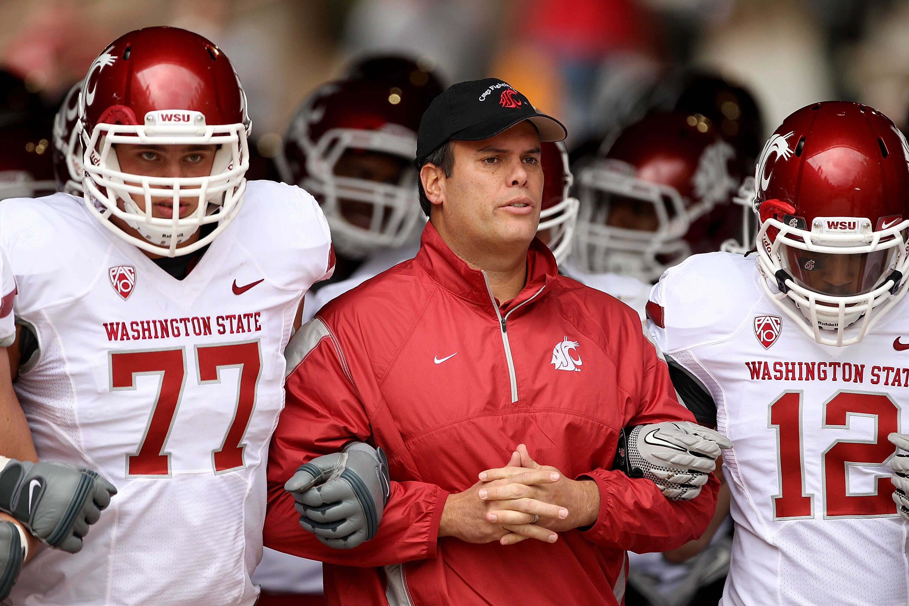 PALO ALTO, CA - OCTOBER 23:  Head coach Paul Wulff of the Washington State Cougars walks out of the tunnel with John Fullington #77 and Jeffrey Solomon #12 for their game against the Stanford Cardinal at Stanford Stadium on October 23, 2010 in Palo Alto, 