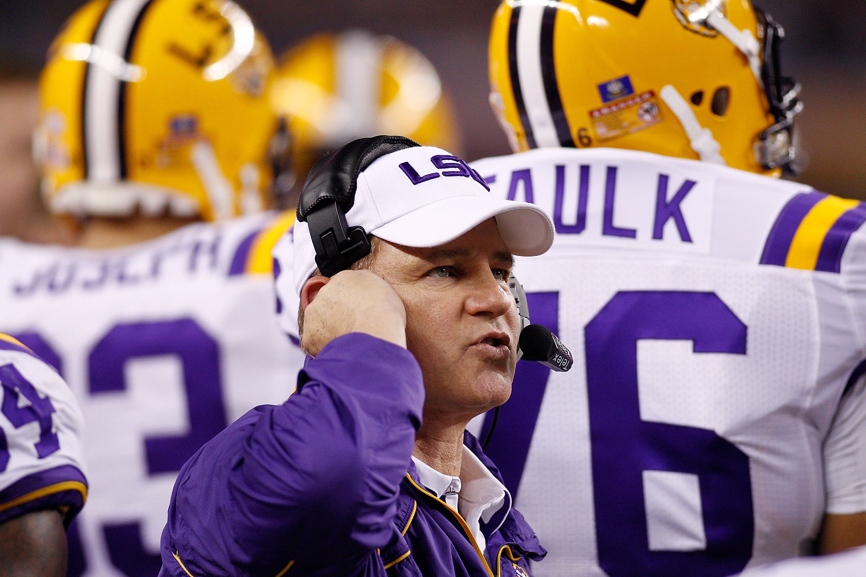 ARLINGTON, TX - JANUARY 07:  Head coach Les Miles of the Louisiana State University Tigers talks wthi his team during a timeout against the Texas A&M Aggies during the AT&T Cotton Bowl at Cowboys Stadium on January 7, 2011 in Arlington, Texas.  (Photo by 