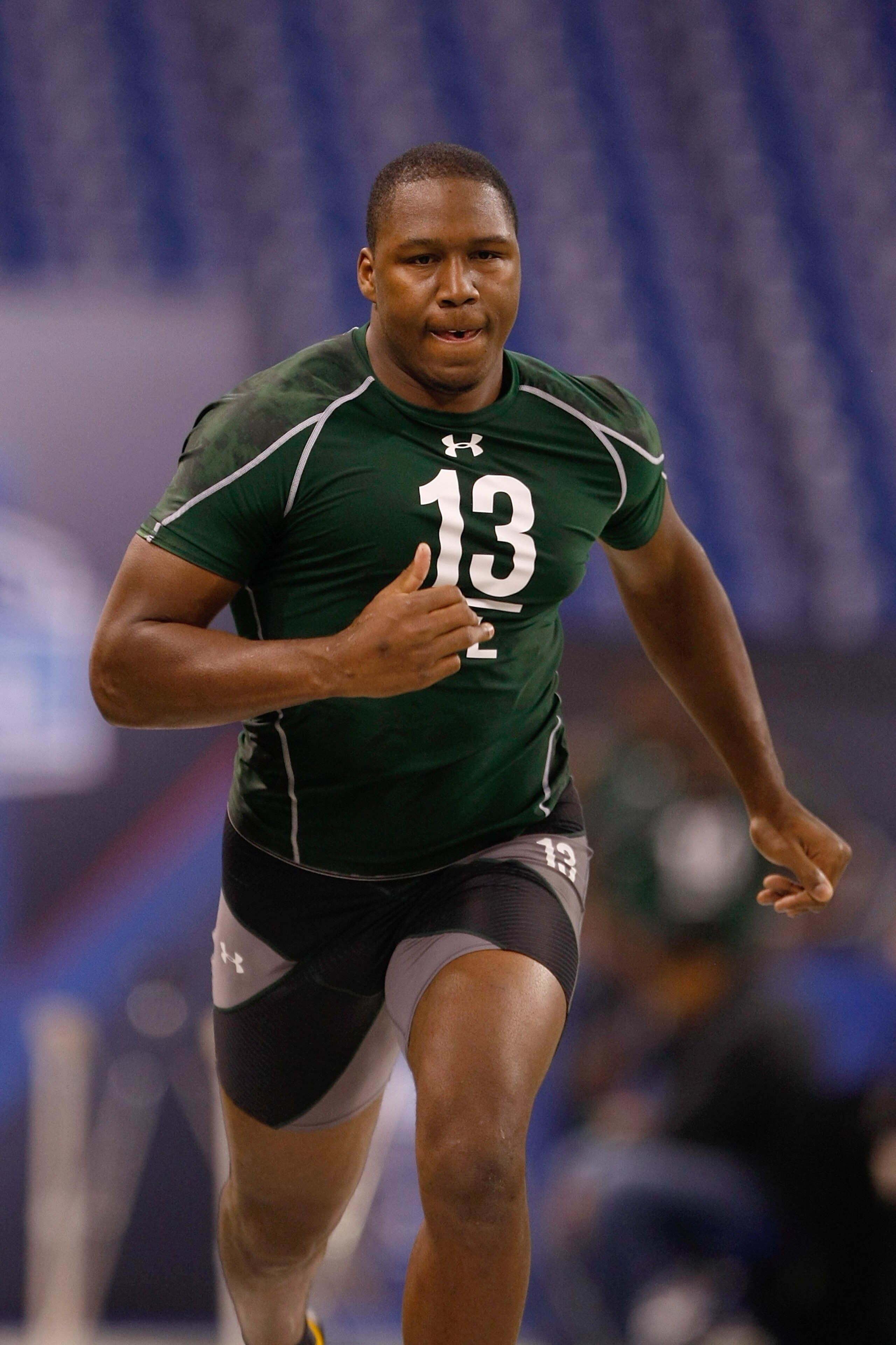 INDIANAPOLIS, IN - MARCH 1: Defensive lineman Carlos Dunlap of Florida runs the 40 yard dash during the NFL Scouting Combine presented by Under Armour at Lucas Oil Stadium on March 1, 2010 in Indianapolis, Indiana. (Photo by Scott Boehm/Getty Images)