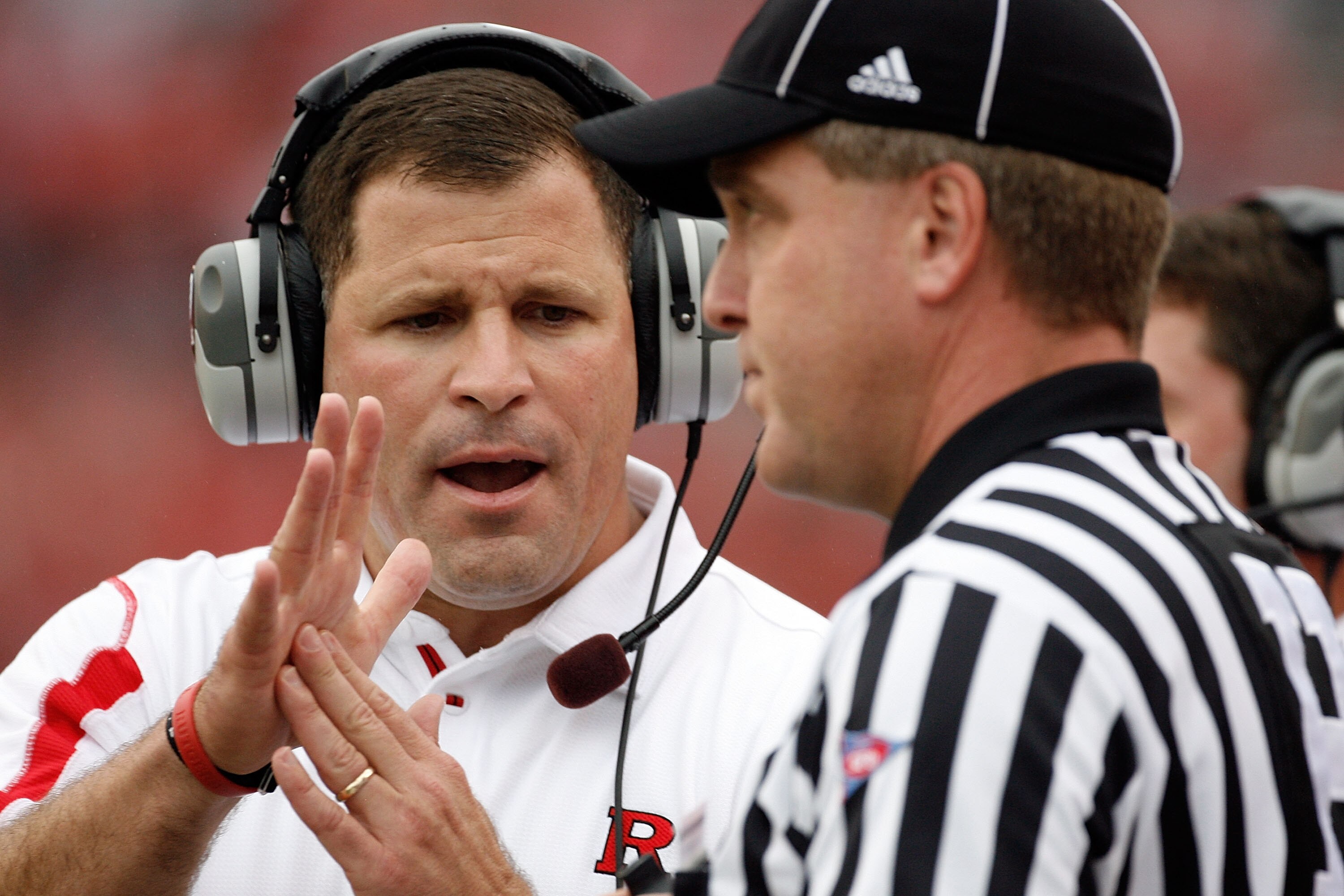 PISCATAWAY, NJ - SEPTEMBER 27:  Head Coach Greg Schiano of the Rutgers Scarlet Knights clarifies an issue with an official during the first quarter against the Morgan State Bears at Rutgers Stadium on September 27, 2008 in Piscataway, New Jersey.  (Photo 