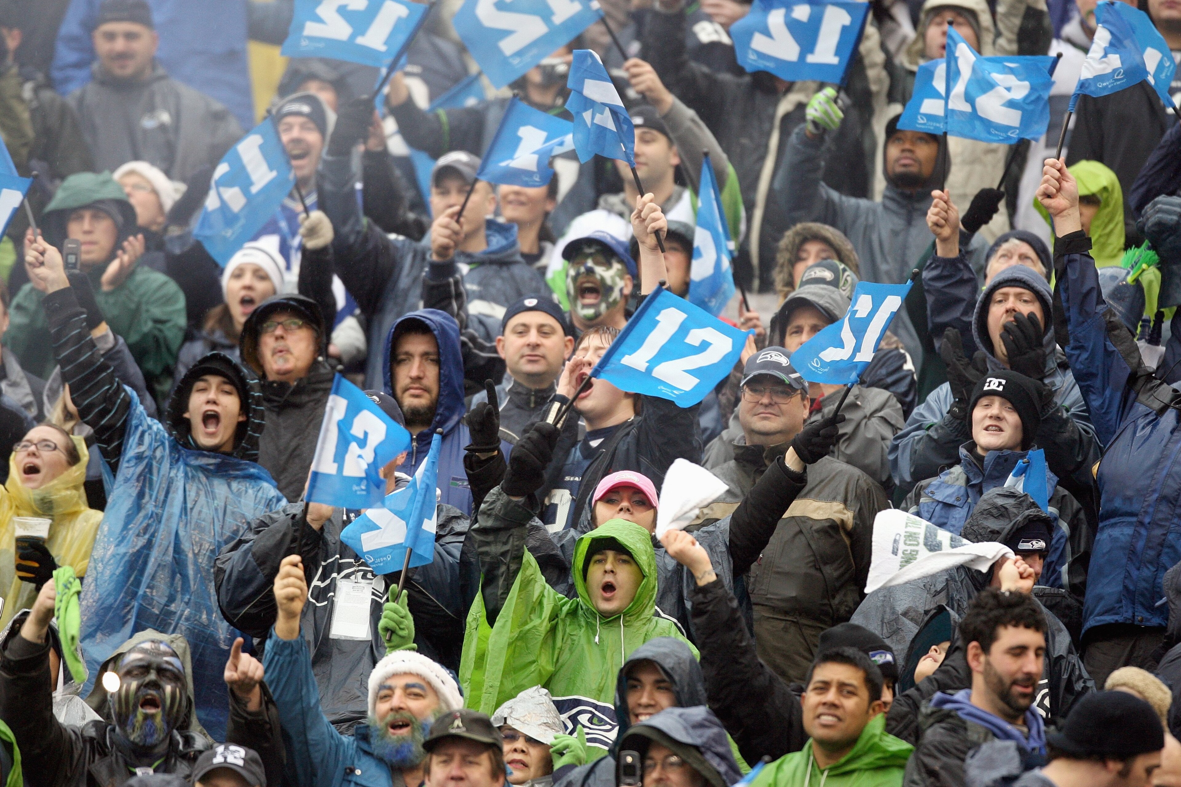 SEATTLE - DECEMBER 23: Fans of the Seattle Seahawks hold up the 12th man signs during the game against the Baltimore Ravens at Qwest Field on December 23, 2007 in Seattle, Washington. The Seahawks defeated the Ravens 27-6. (Photo by Otto Greule Jr/Getty I