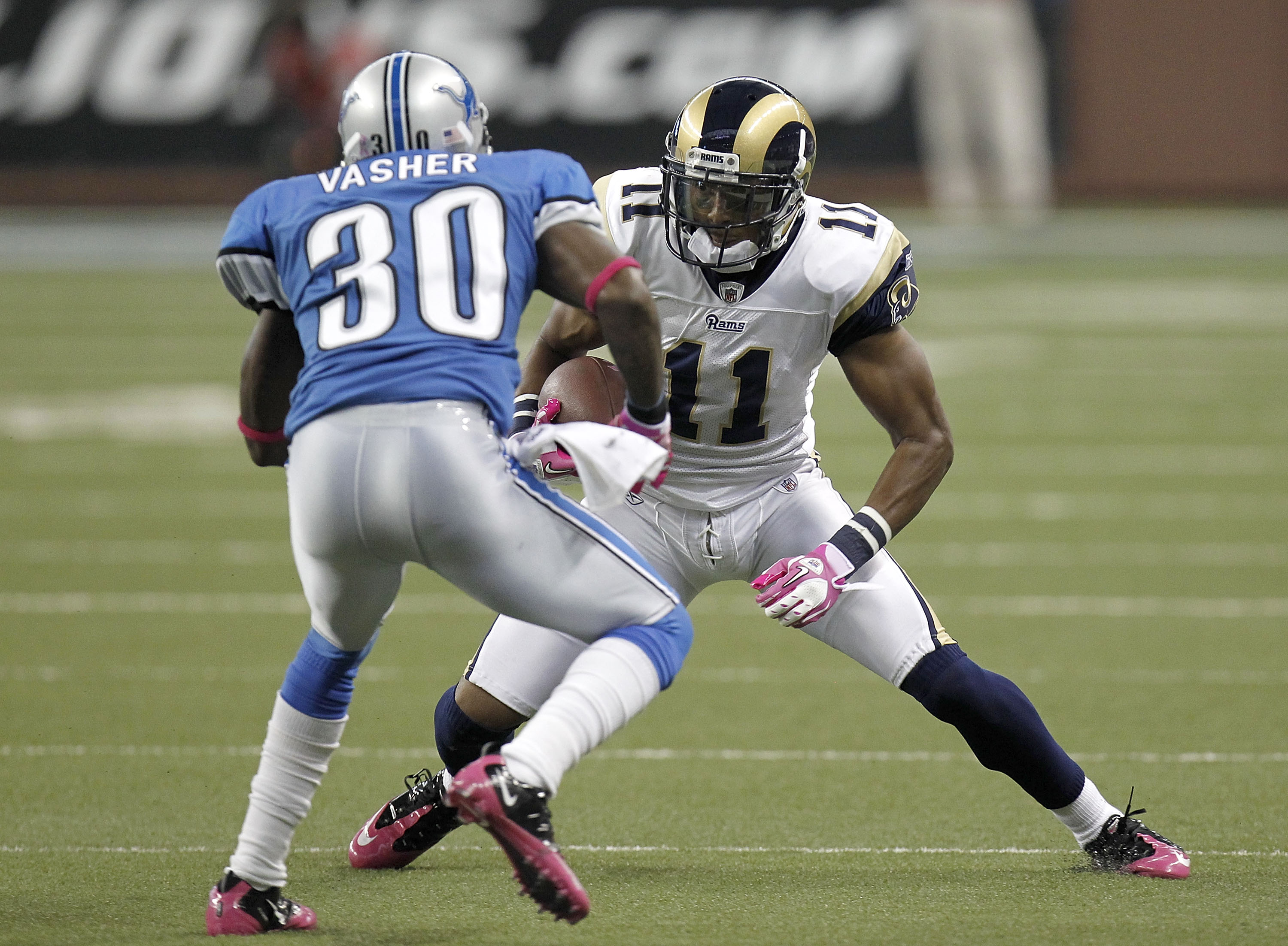 DETROIT - OCTOBER 10: Brandon Gibson #11 of the St. Louis Rams tries to get around the tackle of Nathan Vasher #30 of the Detroit Lions on October 10, 2010 at Ford Field in Detroit, Michigan.  (Photo by Gregory Shamus/Getty Images)