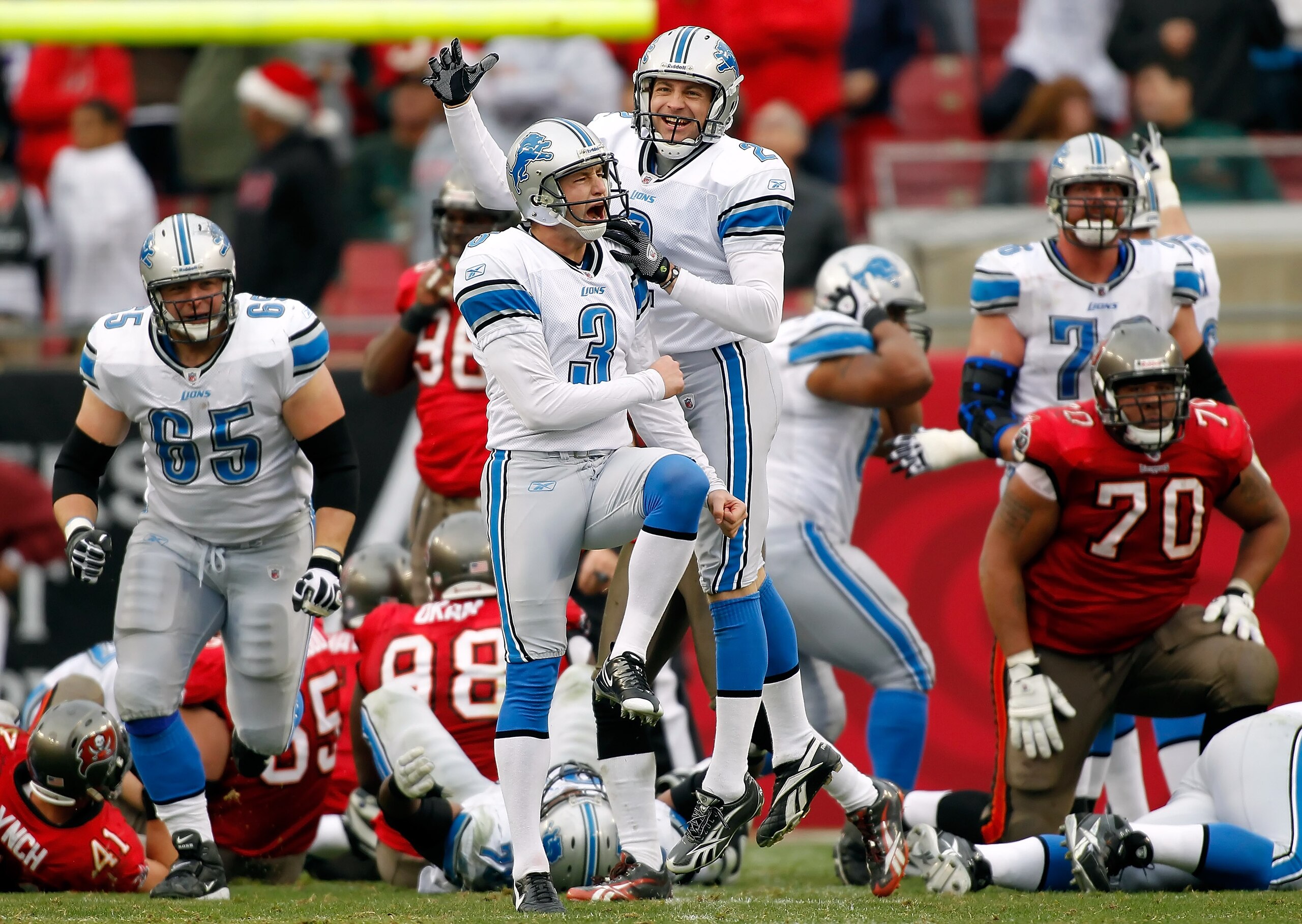 TAMPA, FL - DECEMBER 19: Kicker Dave Rayner #3 of the Detroit Lions celebrates with holder Nick Harris #2 the winning field goal in overtime against the Tampa Bay Buccaneers during the game at Raymond James Stadium on December 19, 2010 in Tampa, Florida. TAMPA, FL - DECEMBER 19: Kicker Dave Rayner #3 of the Detroit Lions celebrates with holder Nick Harris #2 the winning field goal in overtime against the Tampa Bay Buccaneers during the game at Raymond James Stadium on December 19, 2010 in Tampa, Florida.