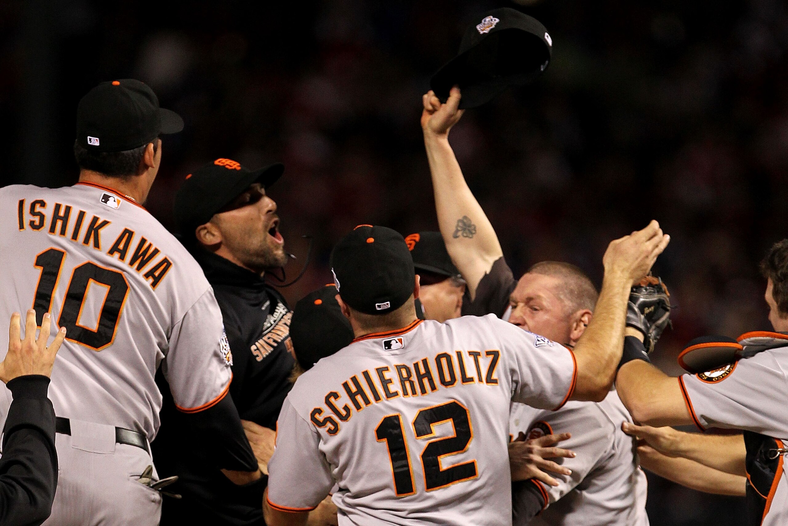 ARLINGTON, TX - NOVEMBER 01:  Mark DeRosa (L) of the San Francisco Giants celebrates with his teammates after they won the World Series against the Texas Rangers in Game Five of the 2010 MLB World Series at Rangers Ballpark in Arlington on November 1, 201