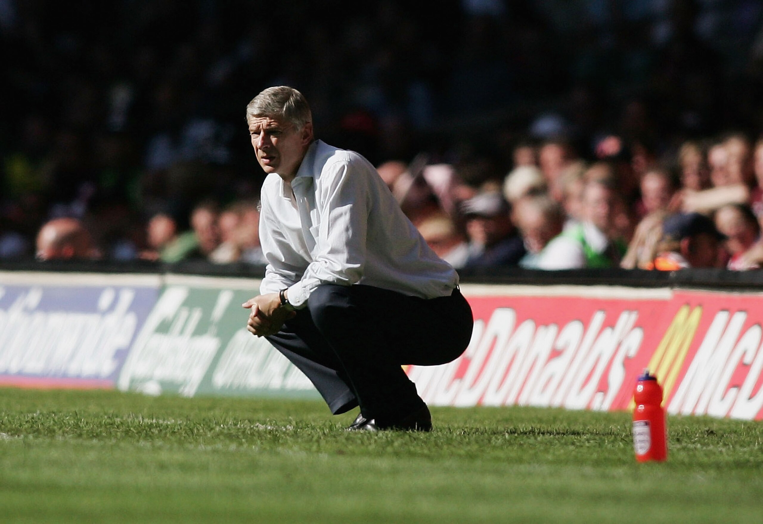 CARDIFF, UNITED KINGDOM - AUGUST 07: Arsene Wenger, manager of Arsenal, looks pensive during the FA Community Shield match between Arsenal and Chelsea held at the Millennium Stadium on August 7, 2005 in Cardiff, Wales. (Photo by Ben Radford/Getty Images CARDIFF, UNITED KINGDOM - AUGUST 07: Arsene Wenger, manager of Arsenal, looks pensive during the FA Community Shield match between Arsenal and Chelsea held at the Millennium Stadium on August 7, 2005 in Cardiff, Wales. (Photo by Ben Radford/Getty Images