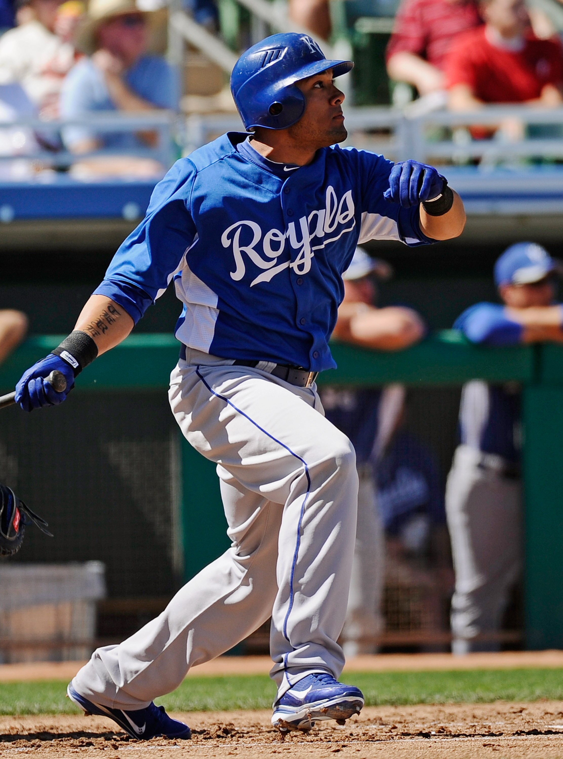 MESA, AZ - MARCH 09:  Melky Cabrera #53 of the Kansas City Royals hits a three-run triple to score teammates Mike Aviles #13, Billy Butler #16 and Jeff Francoeur #21 during the first inning against pitcher Matt Garza #17 of the Chicago Cubs during the spr