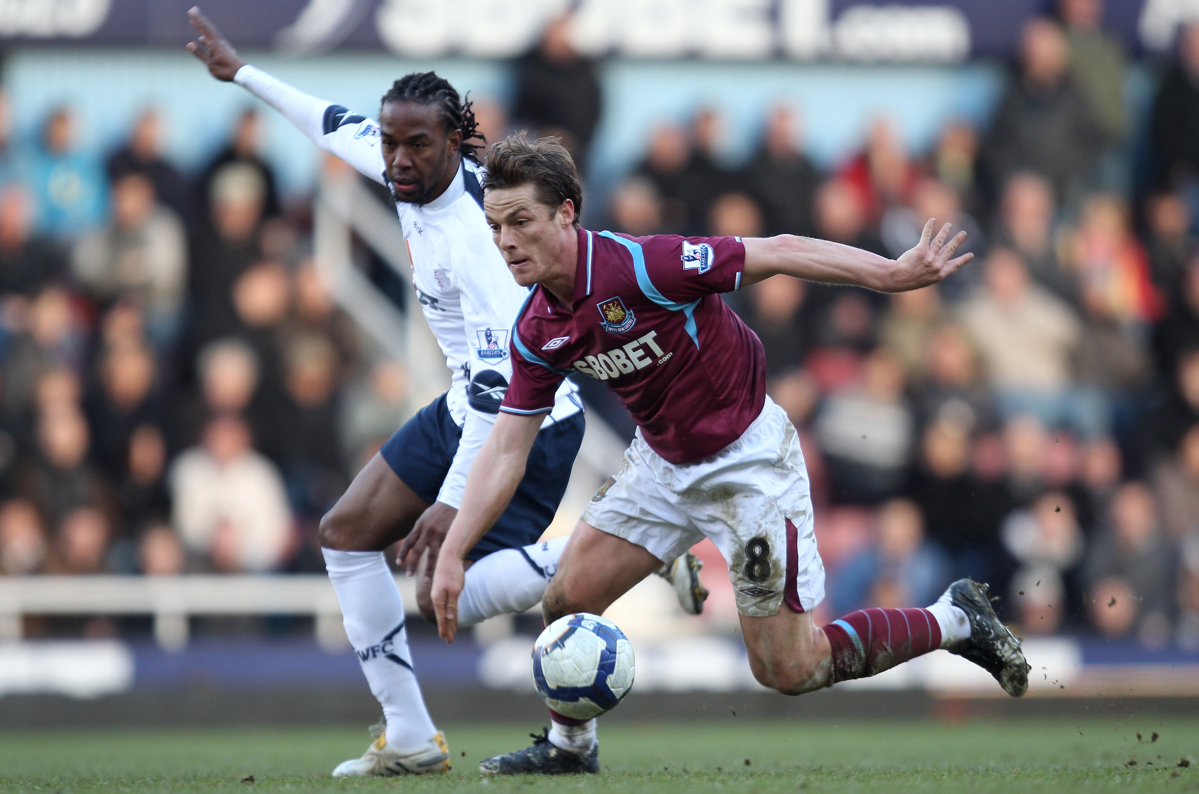 LONDON, ENGLAND - MARCH 06:   Scott Parker of West Ham United tangles with Ricardo Gardner of Bolton Wanderers during the Barclays Premier League match between West Ham United and Bolton Wanderers at the Boleyn Ground on March 6, 2010 in London, England.