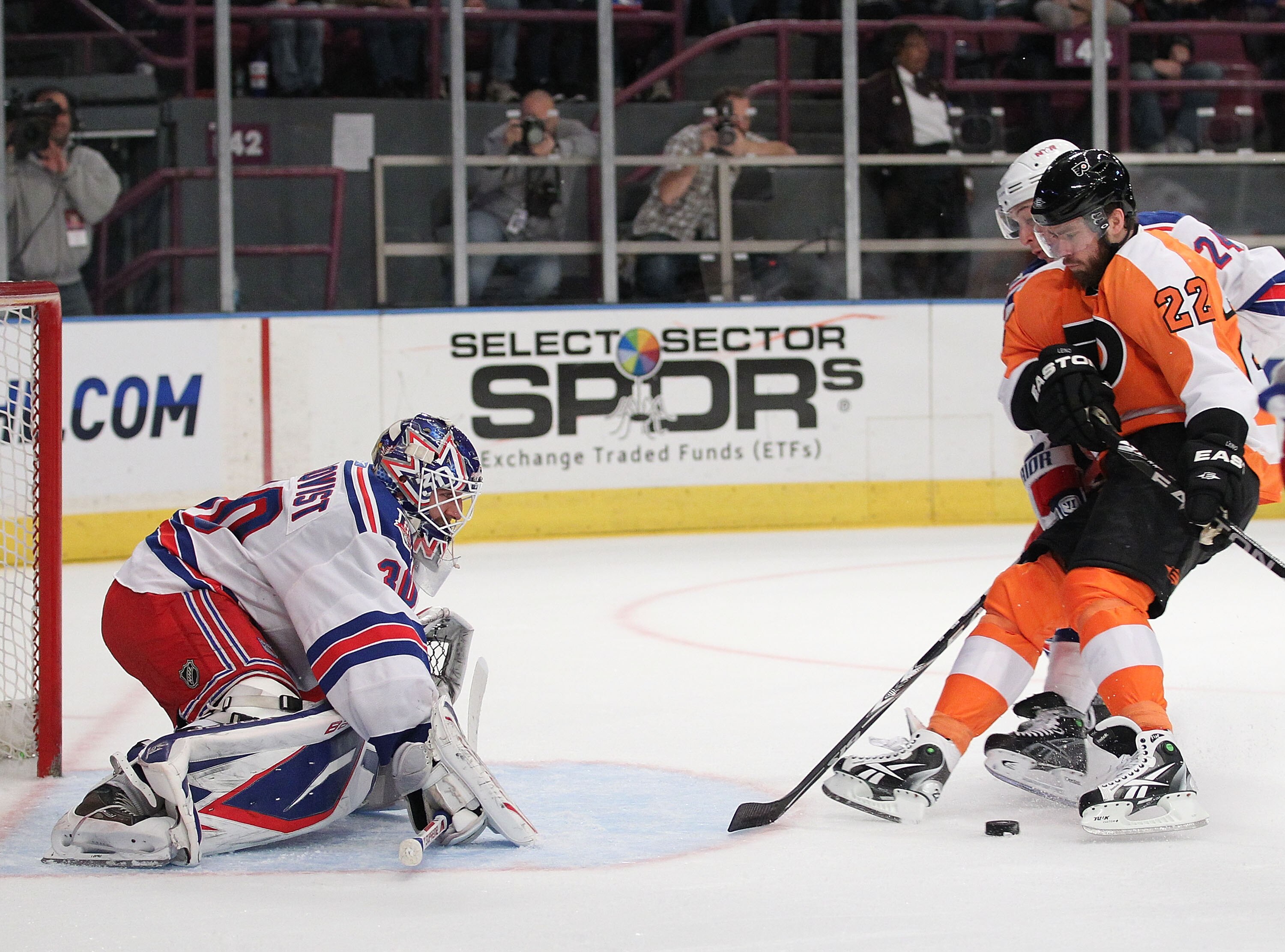 NEW YORK - MARCH 06:  Henrik Lundqvist #30 of the New York Rangers defends against Ville Leino #22 of the Philadelphia Flyers during their game on March 6, 2011 at Madison Square Garden in New York City, New York.  (Photo by Al Bello/Getty Images)