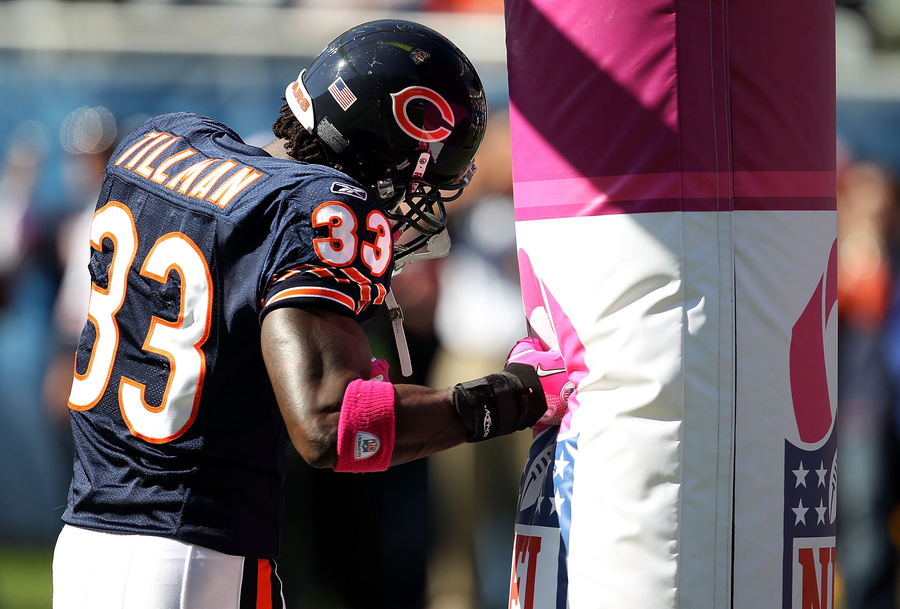 CHICAGO - OCTOBER 17: Charles Tillman #33 of the Chicago Bears uses the goal post as a punching bag during warm-ups before a game against the Seattle Seahawks at Soldier Field on October 17, 2010 in Chicago, Illinois. (Photo by Jonathan Daniel/Getty Image