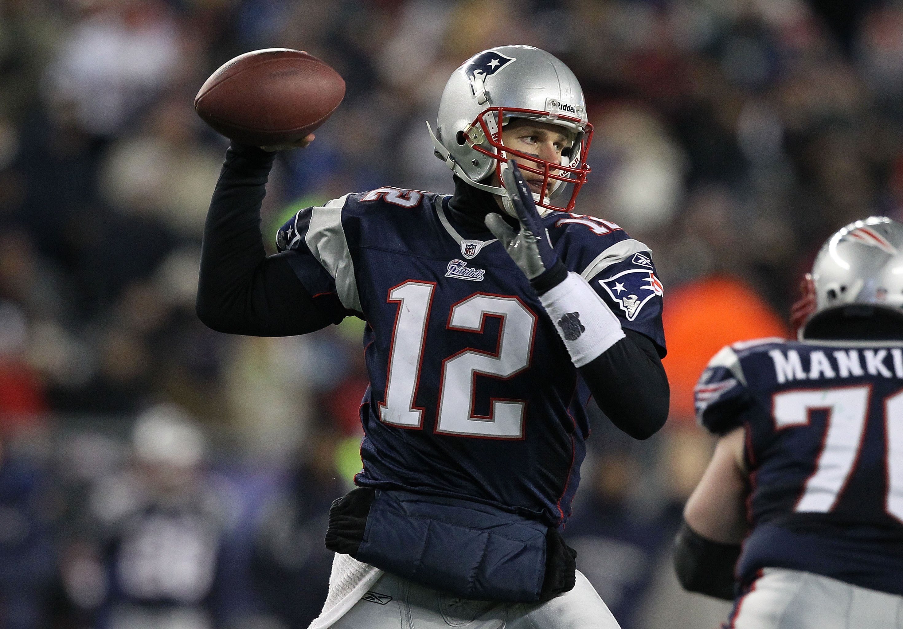 FOXBORO, MA - JANUARY 16:  Quarterback Tom Brady #12 of the New England Patriots throws a pass during their 2011 AFC divisional playoff game against the New York Jets at Gillette Stadium on January 16, 2011 in Foxboro, Massachusetts.  (Photo by Al Bello/G