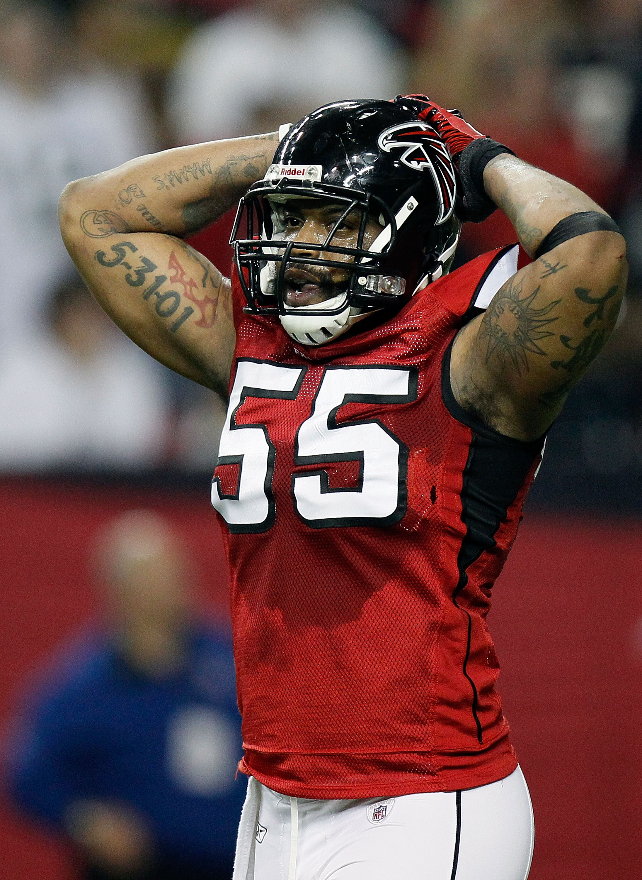 ATLANTA, GA - JANUARY 15:  John Abraham #5 of the Atlanta Falcons reacts against the Green Bay Packers during their 2011 NFC divisional playoff game at Georgia Dome on January 15, 2011 in Atlanta, Georgia.  (Photo by Kevin C. Cox/Getty Images)