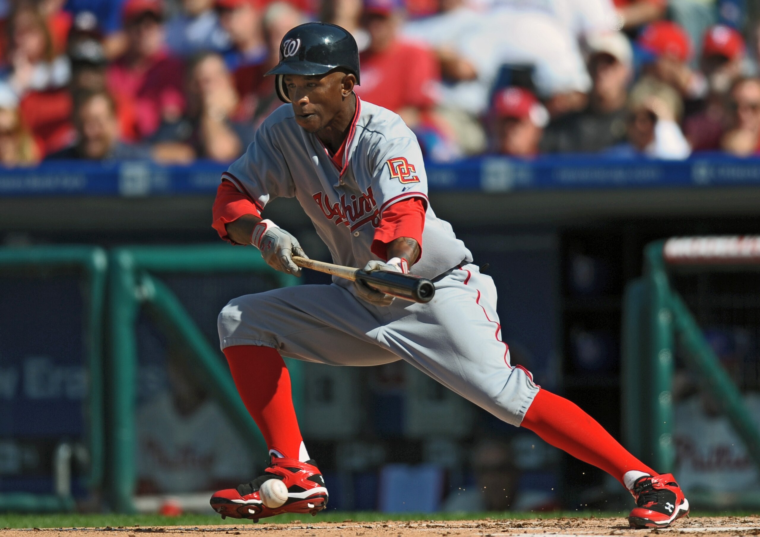 PHILADELPHIA - APRIL 12: Nyjer Morgan #1 of the Washington Nationals bunts during the game against the Philadelphia Phillies on Opening Day at Citizens Bank Park on April 12, 2010 in Philadelphia, Pennsylvania. The Phillies won 7-4. (Photo by Drew Hallowe