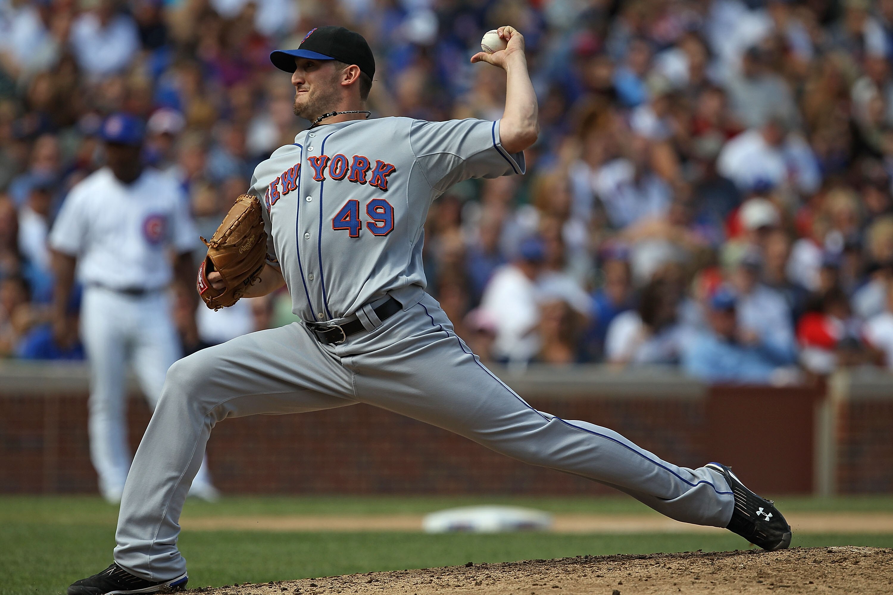 CHICAGO - SEPTEMBER 05: Starting pitcher Jonathan Niese #49 of the New York Mets delivers the ball against the Chicago Cubs at Wrigley Field on September 5, 2010 in Chicago, Illinois. The Mets defeated the Cubs 18-5. (Photo by Jonathan Daniel/Getty Images
