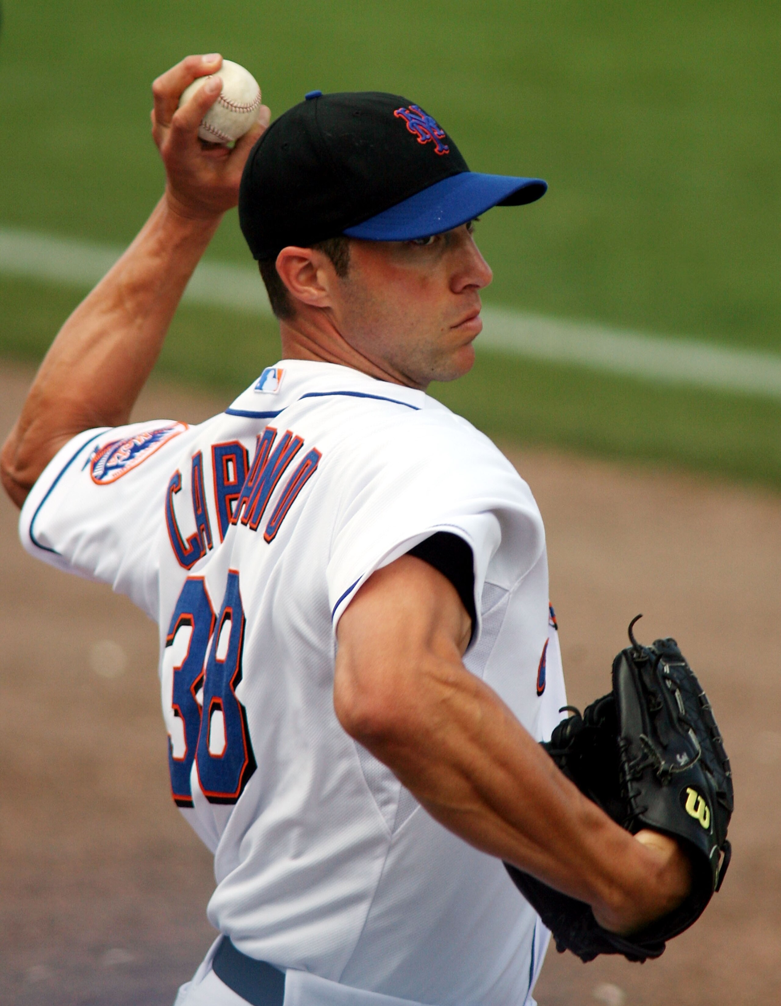 PORT ST. LUCIE, FL - MARCH 03: Pitcher Chris Capuano #38 of the New York Mets throws against the St. Louis Cardinals at Digital Domain Park on March 3, 2011 in Port St. Lucie, Florida.  (Photo by Marc Serota/Getty Images)