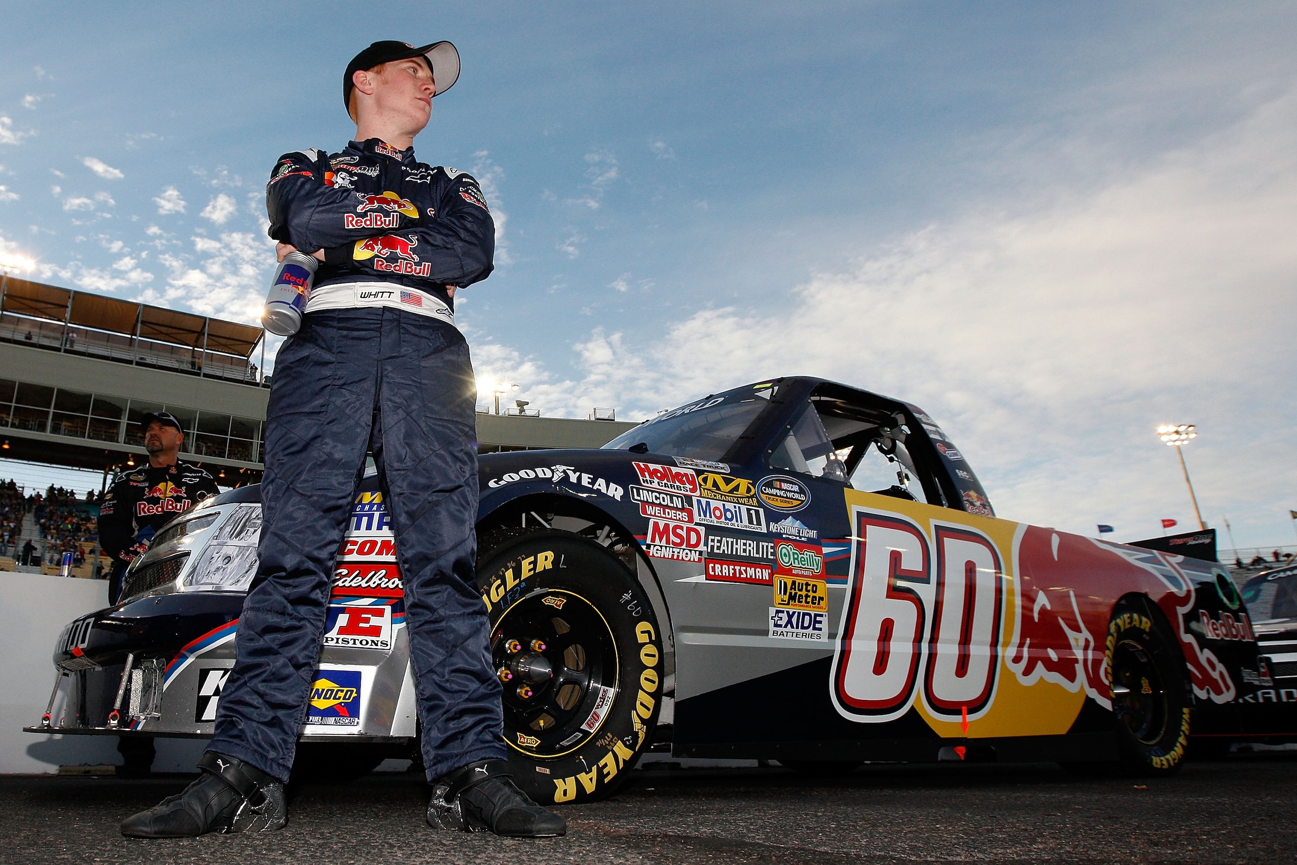 AVONDALE, AZ - FEBRUARY 25:  Cole Whitt, driver of the #60 Red Bull Chevrolet, stands by his truck prior to the NASCAR Camping World Truck Series Lucas Oil 150 at Phoenix International Raceway on February 25, 2011 in Avondale, Arizona.  (Photo by Chris Gr
