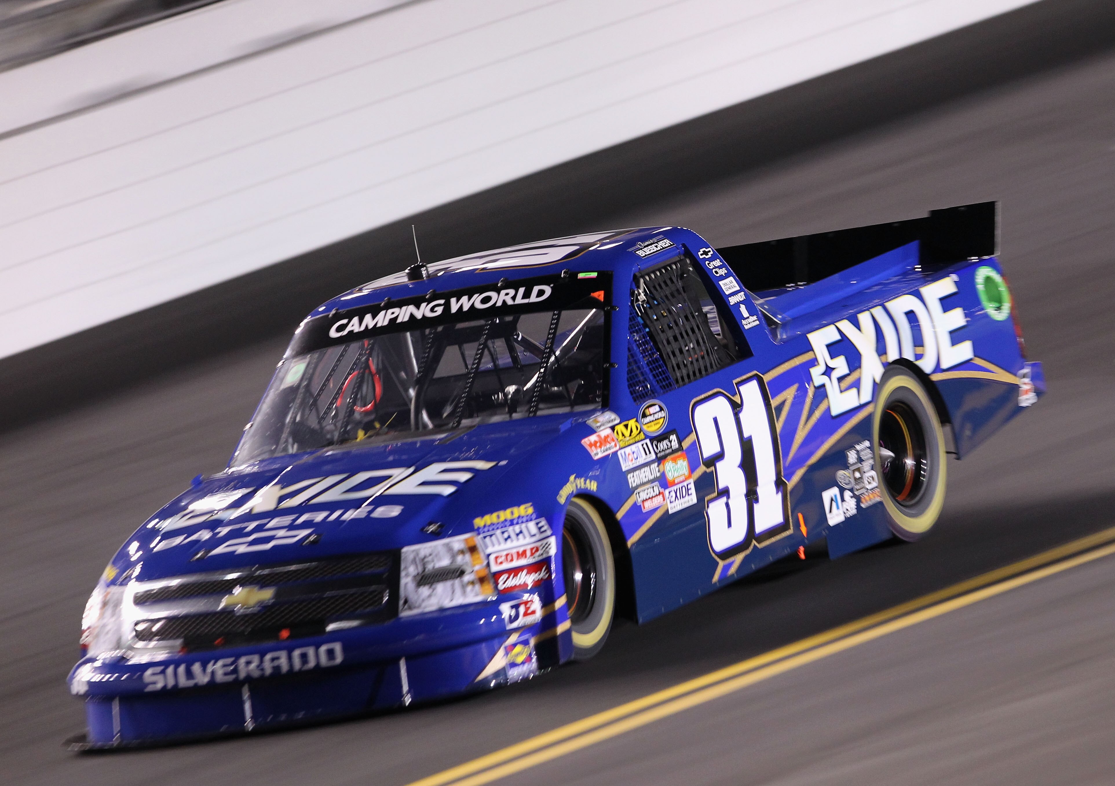 DAYTONA BEACH, FL - FEBRUARY 18:  James Buescher, driver of the #31 Exide Batteries Chevrolet, races during the NASCAR Camping World Truck Series NextEra Energy Resources 250 at Daytona International Speedway on February 18, 2011 in Daytona Beach, Florida