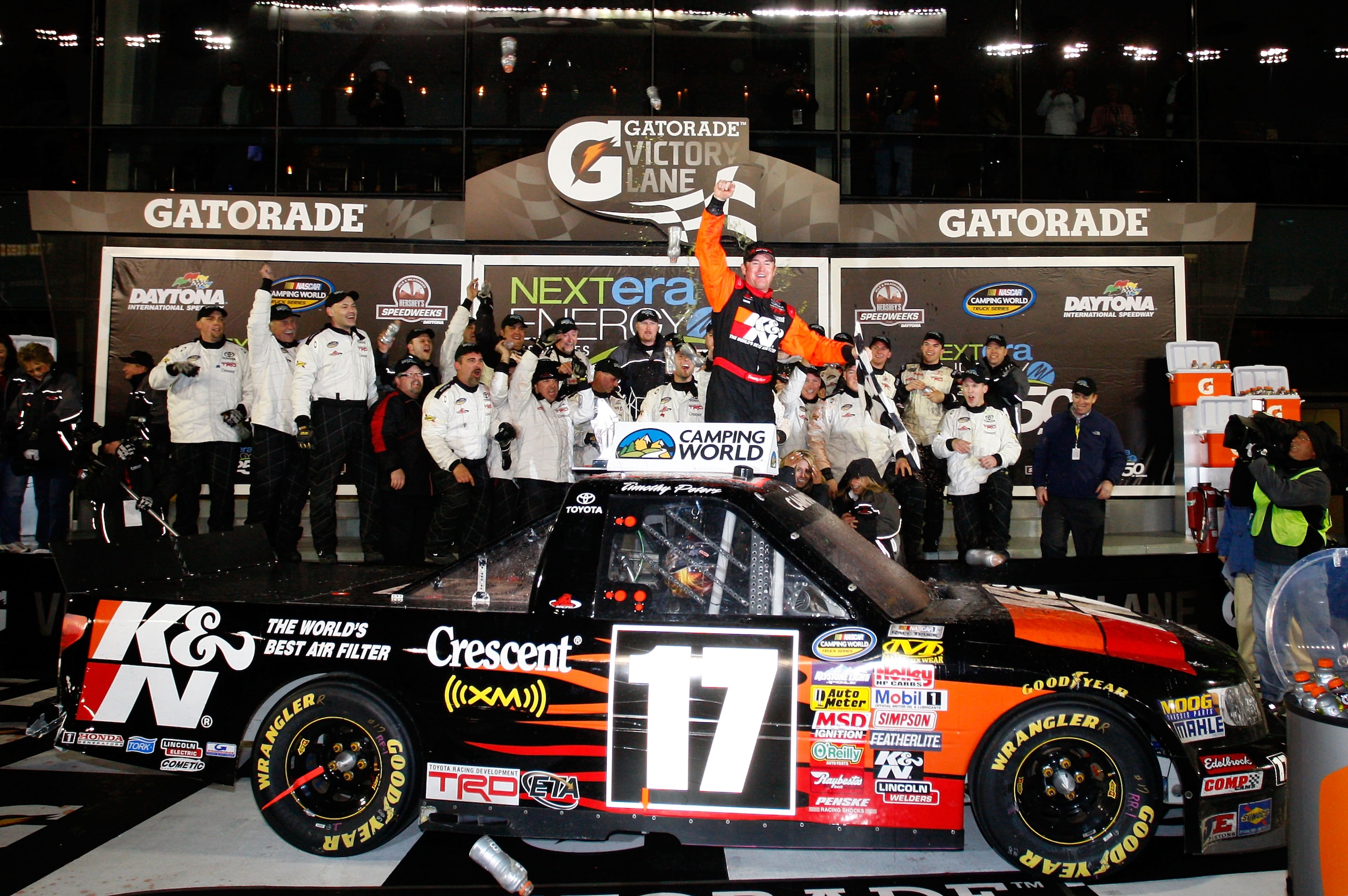 DAYTONA BEACH, FL - FEBRUARY 13:  Timothy Peters, driver of the #17 K&N Toyota, celebrates in Victory Lane after winning the NASCAR Camping World Truck Series Nextera Energy Resources 250 at Daytona International Speedway on February 13, 2010 in Daytona B