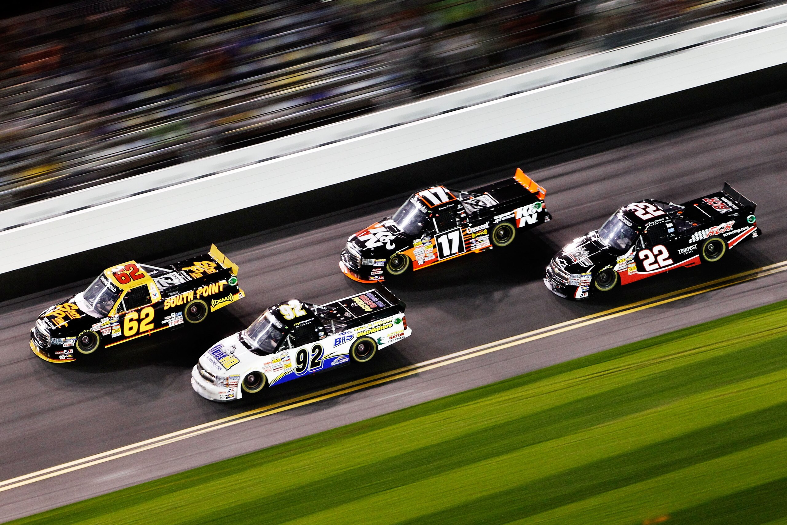 DAYTONA BEACH, FL - FEBRUARY 18:  Brendan Gaughan, driver of the #62 South Point Hotel & Casino Toyota, Timothy Peters, driver of the #17 K&N Toyota, Clay Rogers, driver of the #92 Action Gator Tire Chevrolet, and Joey Coulter, driver of the #22 RCR Chevr