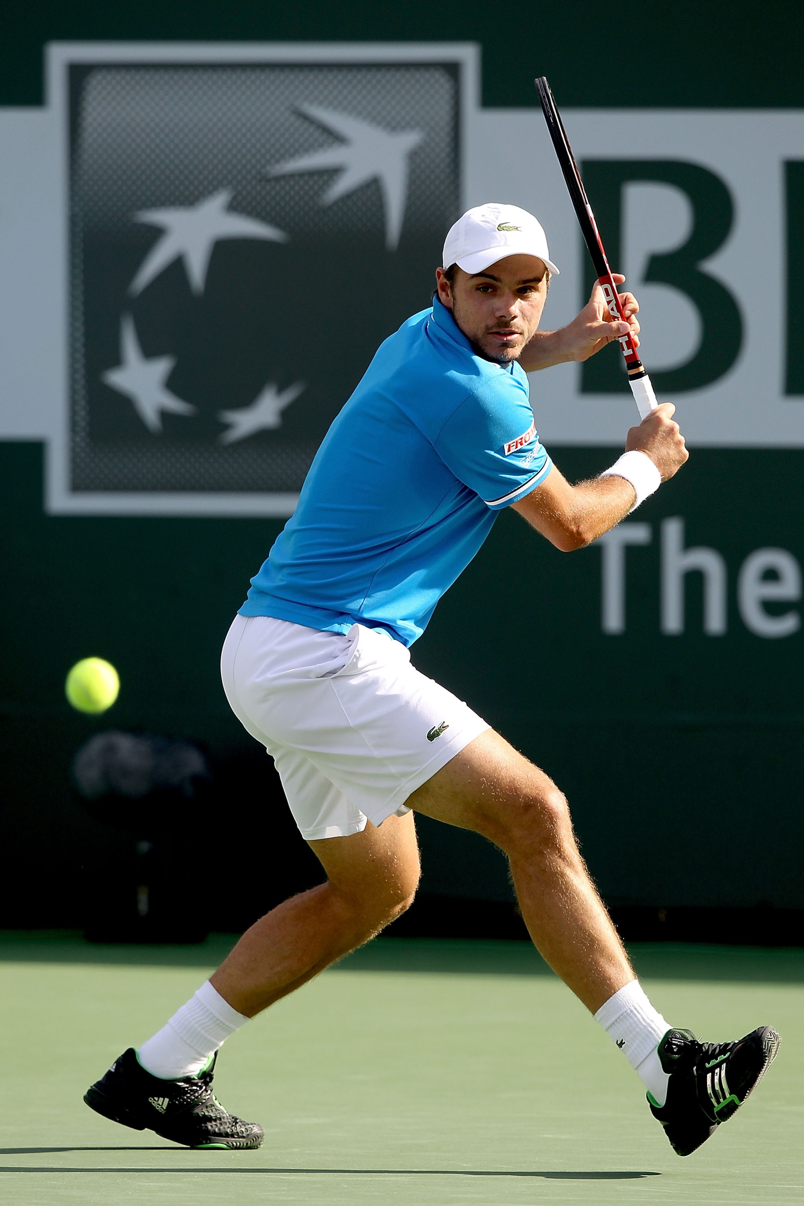 INDIAN WELLS, CA - MARCH 18: Stanislas Wawrinka of Switzerland returns a shot to Roger Federer of Switzerland during the BNP Paribas Open at the Indian Wells Tennis Garden on March 18, 2011 in Indian Wells, California.  (Photo by Matthew Stockman/Getty Im