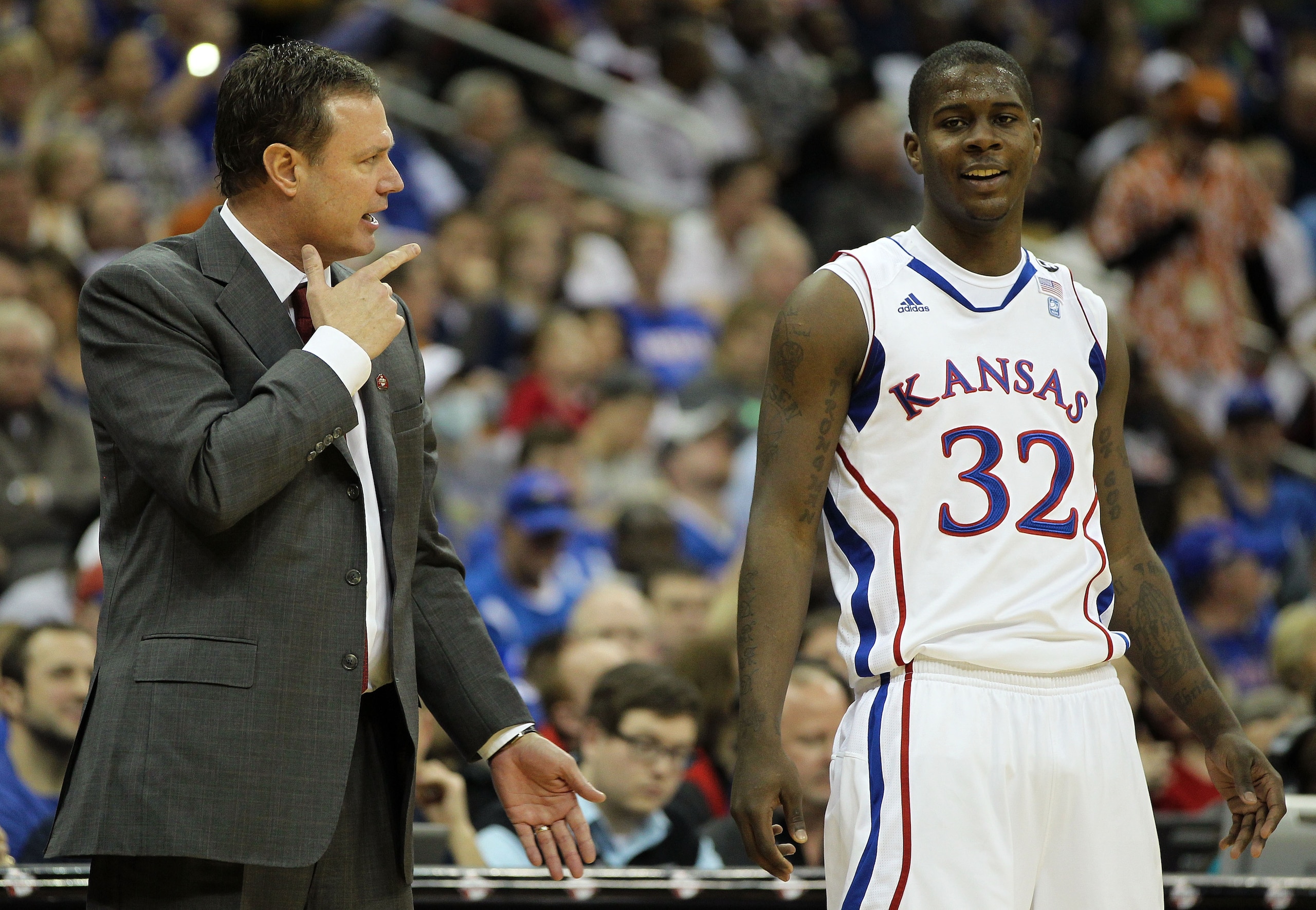 KANSAS CITY, MO - MARCH 11: Head coach Bill Self of the Kansas Jayhawks speaks with Josh Selby #32 during their semifinal game against the Colorado Buffaloes in the 2011 Phillips 66 Big 12 Men's Basketball Tournament at Sprint Center on March 11, 2011 i KANSAS CITY, MO - MARCH 11: Head coach Bill Self of the Kansas Jayhawks speaks with Josh Selby #32 during their semifinal game against the Colorado Buffaloes in the 2011 Phillips 66 Big 12 Men's Basketball Tournament at Sprint Center on March 11, 2011 i
