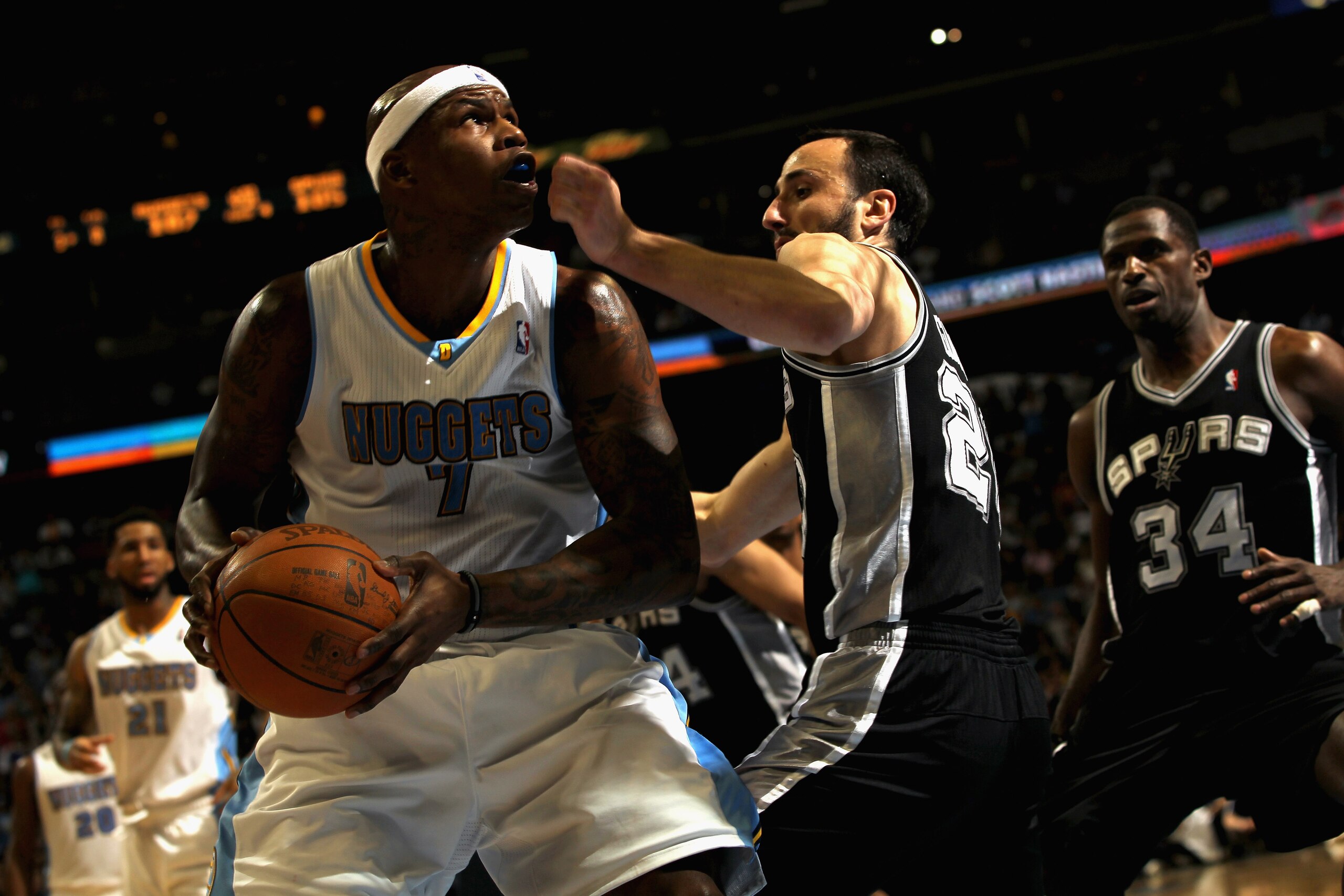 DENVER, CO - MARCH 23:  Al Harrington #7 of the Denver Nuggets looks to take a shot against Manu Ginobili #20 of the San Antonio Spurs at the Pepsi Center on March 23, 2011 in Denver, Colorado. Harrington had a game high 27 points as the Nuggets defeated
