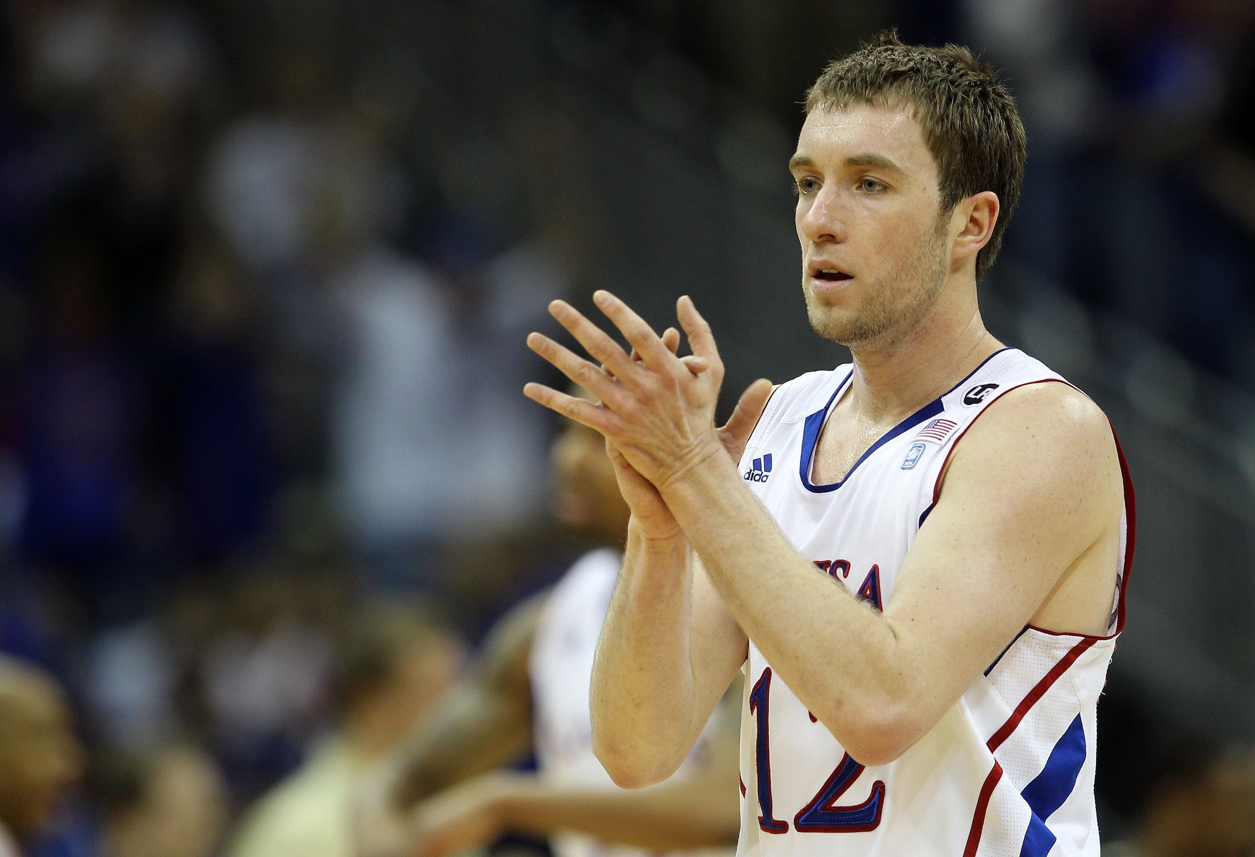 KANSAS CITY, MO - MARCH 11: Brady Morningstar #12 of the Kansas Jayhawks reacts to a play against the Colorado Buffaloes during their semifinal game in the 2011 Phillips 66 Big 12 Men's Basketball Tournament at Sprint Center on March 11, 2011 in Kansas C KANSAS CITY, MO - MARCH 11: Brady Morningstar #12 of the Kansas Jayhawks reacts to a play against the Colorado Buffaloes during their semifinal game in the 2011 Phillips 66 Big 12 Men's Basketball Tournament at Sprint Center on March 11, 2011 in Kansas C