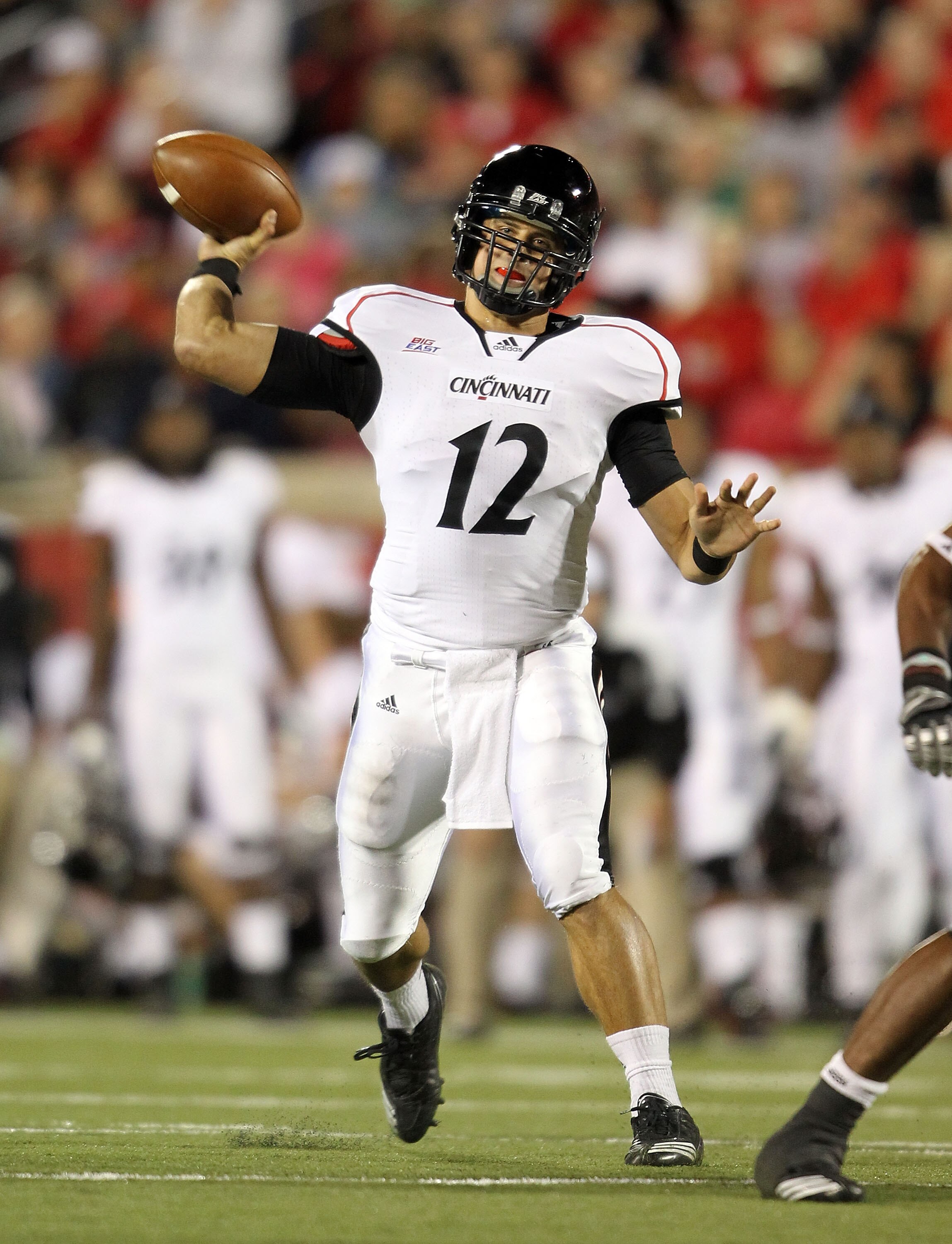 LOUISVILLE, KY - OCTOBER 15:  Zach Collaros #12 of the Cincinnati Bearcats throws a pass during the Big East Conference game against the Louisville Cardinals at Papa John's Cardinal Stadium on October 15, 2010 in Louisville, Kentucky.  (Photo by Andy Lyon