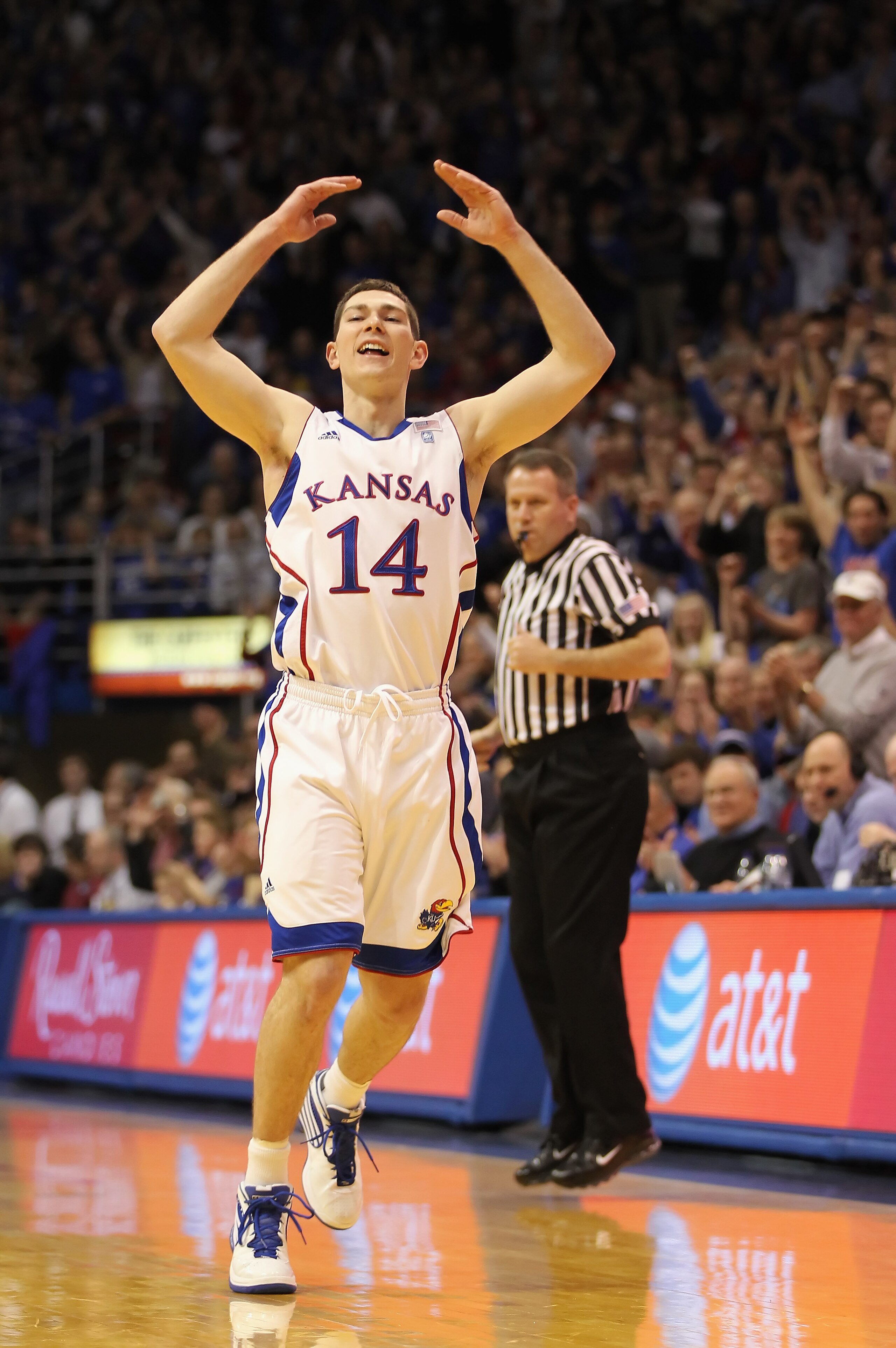 LAWRENCE, KS - MARCH 02: Tyrel Reed #14 of the Kansas Jayhawks celebrates after making the first three-pointer of the game during the game against the Texas A&M Aggies on March 2, 2011 at Allen Fieldhouse in Lawrence, Kansas. (Photo by Jamie Squire/Gett LAWRENCE, KS - MARCH 02: Tyrel Reed #14 of the Kansas Jayhawks celebrates after making the first three-pointer of the game during the game against the Texas A&M Aggies on March 2, 2011 at Allen Fieldhouse in Lawrence, Kansas. (Photo by Jamie Squire/Gett