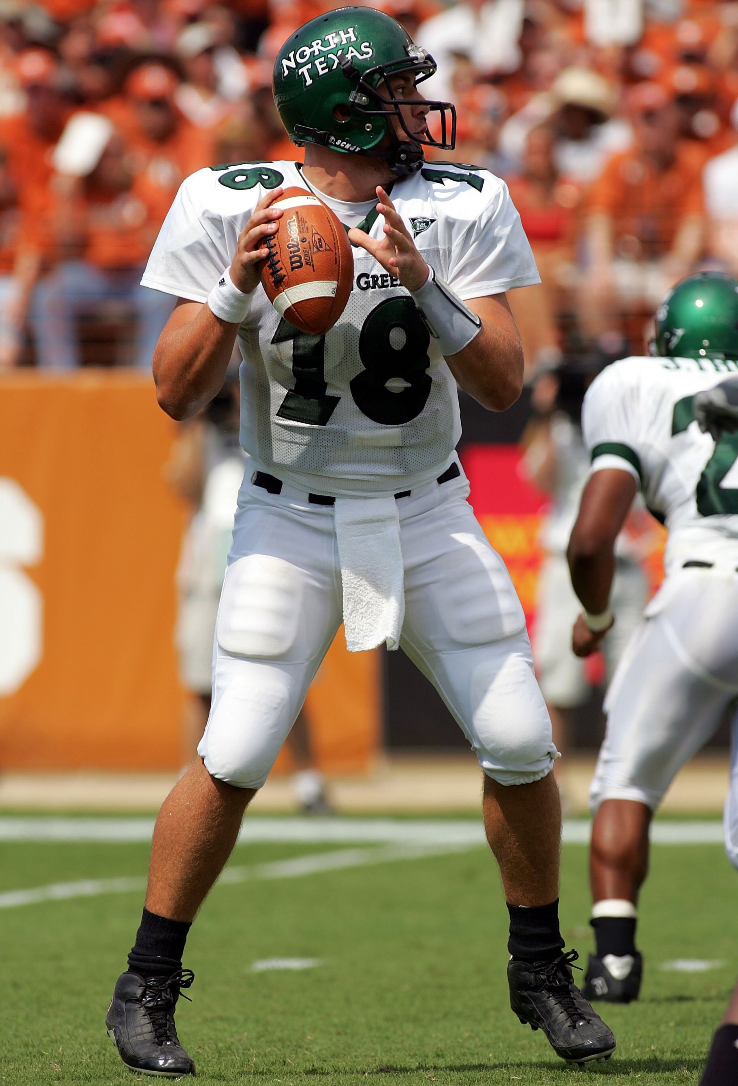 AUSTIN, TX - SEPTEMBER 2:  Quarterback Matt Phillips #18 of the North Texas Eagles drops back to pass against the Texas Longhorns on September 2, 2006 at Texas Memorial Stadium in Austin, Texas. The Longhorns defeated the Eagles 56-7.  (Photo by Ronald Ma