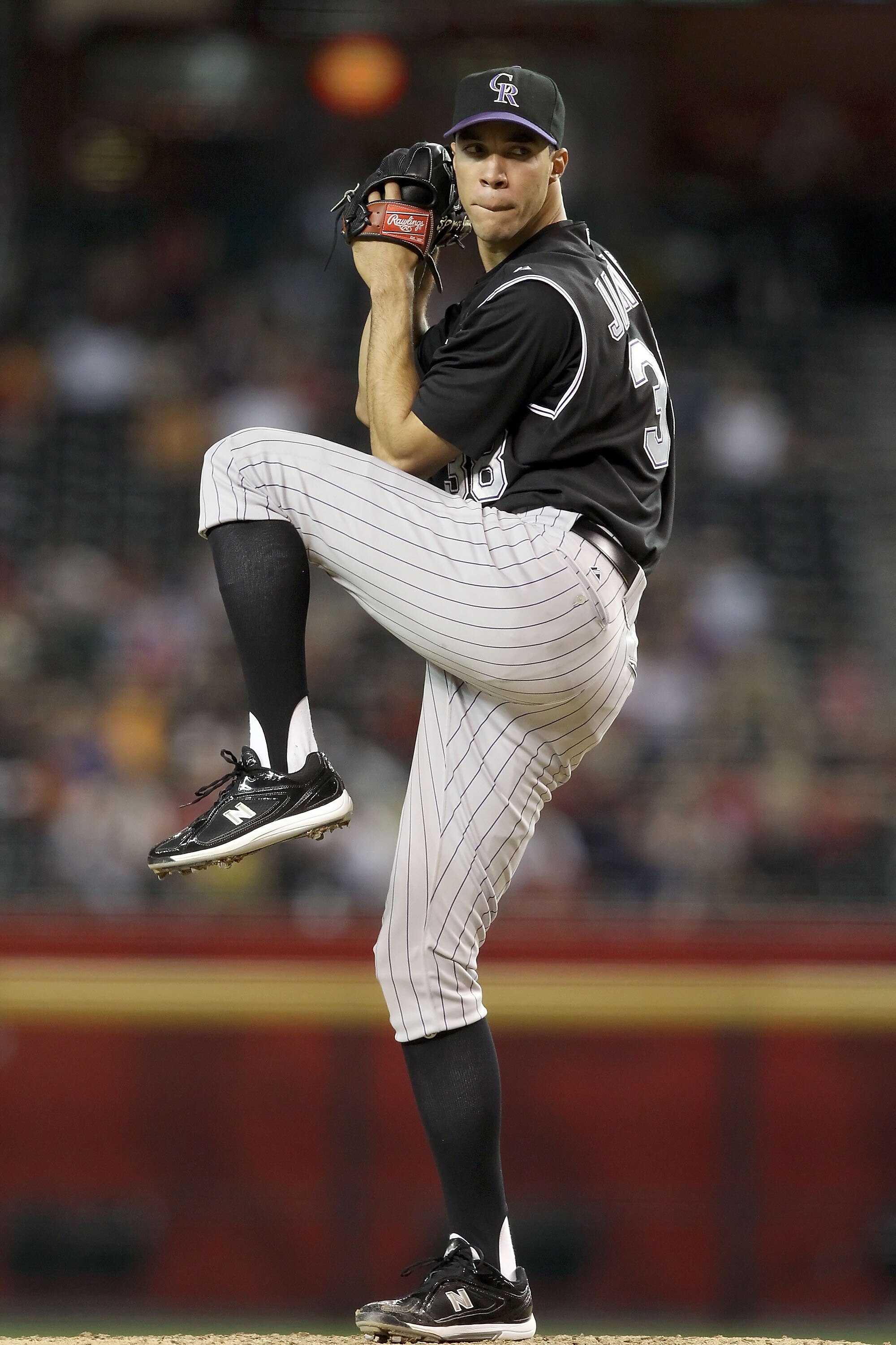 PHOENIX - SEPTEMBER 22:  Starting pitcher Ubaldo Jimenez #38 of the Colorado Rockies pitches against the Arizona Diamondbacks during the Major League Baseball game at Chase Field on September 22, 2010 in Phoenix, Arizona.  (Photo by Christian Petersen/Get