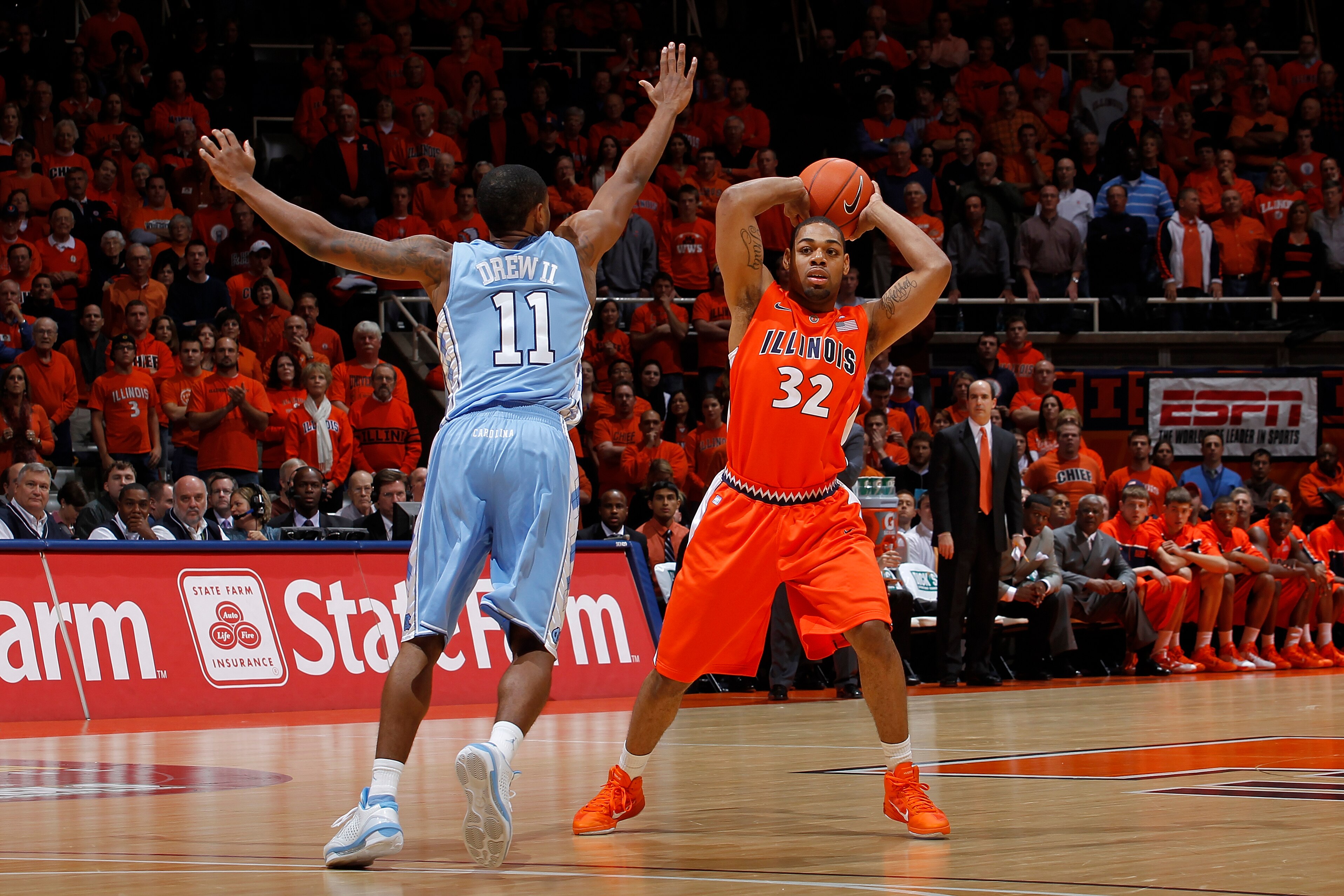 CHAMPAIGN, IL - NOVEMBER 30: Demetri McCamey #32 of the Illinois Fighting Illini looks to pass around Larry Drew II #11 of the North Carolina Tar Heels during first half action of the 2010 ACC/Big Ten Challenge at Assembly Hall on November 30, 2010 in Cha