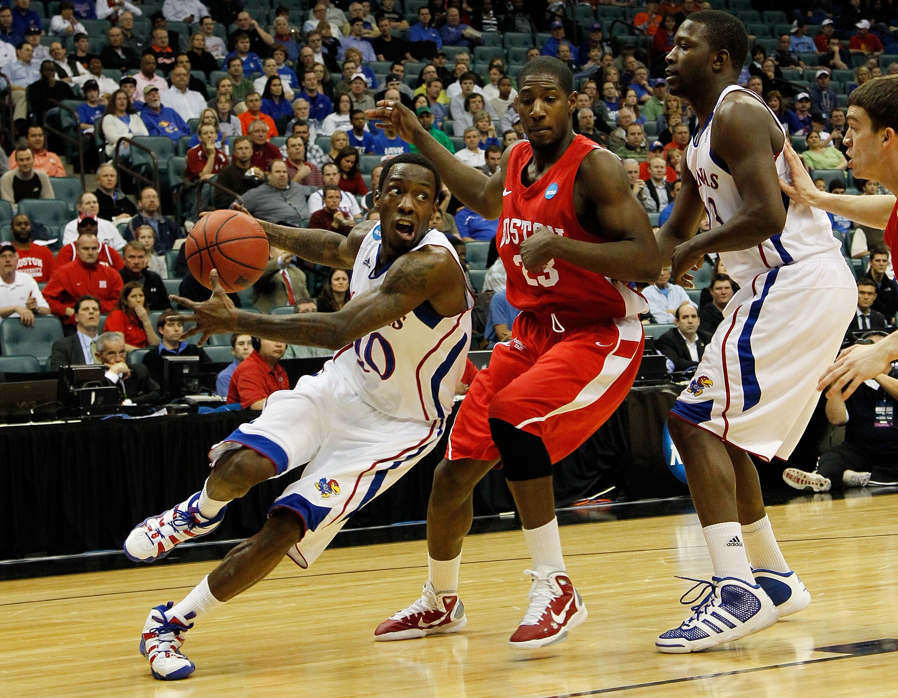 TULSA, OK - MARCH 18:  Tyshawn Taylor #10 of the Kansas Jayhawks drives with the ball against the Boston University Terriers during the second round of the 2011 NCAA men's basketball tournament at BOK Center on March 18, 2011 in Tulsa, Oklahoma.  (Photo b