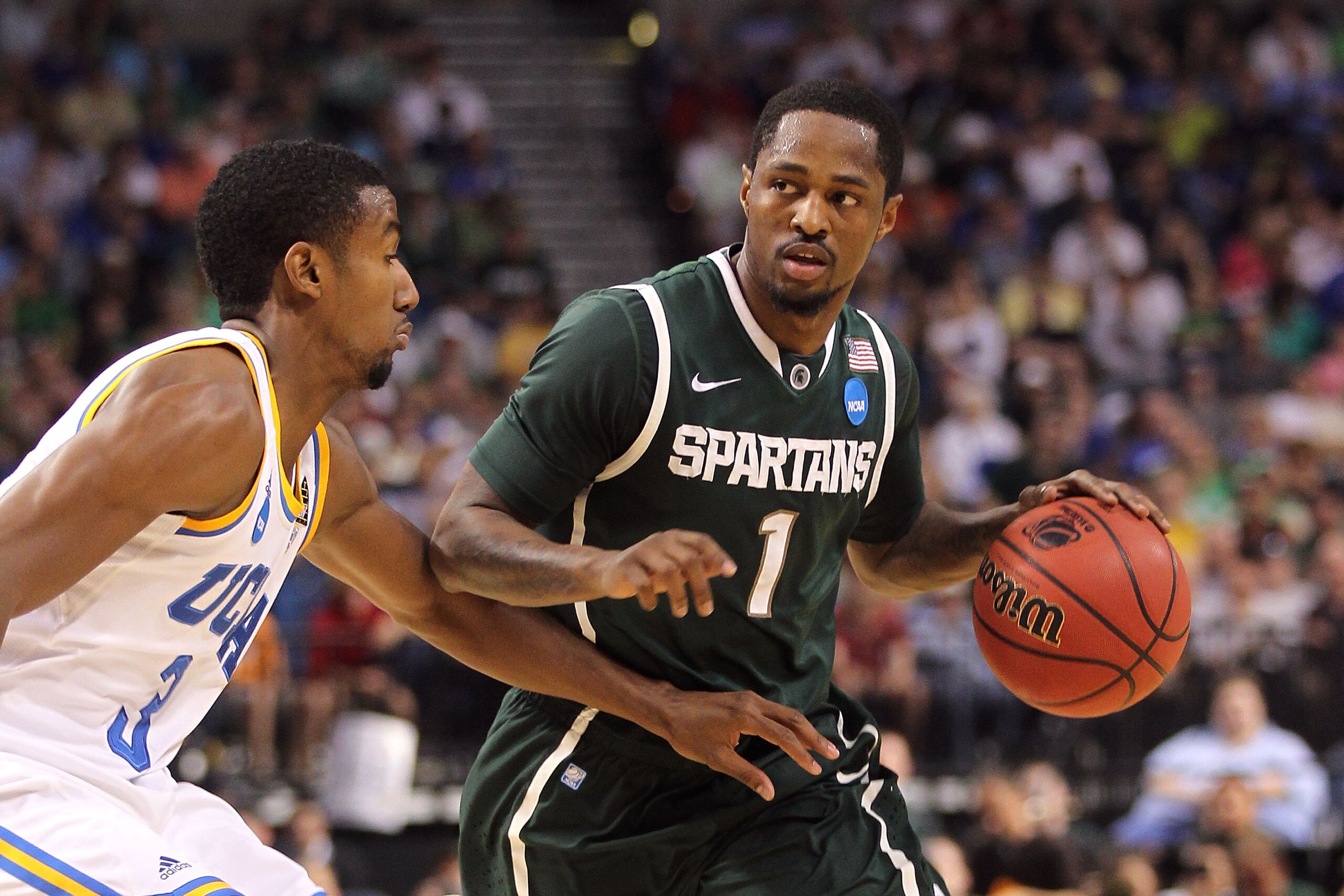 TAMPA, FL - MARCH 17:  Kalin Lucas #1 of the Michigan State Spartans drives against the UCLA Bruins during the second round of the 2011 NCAA men's basketball tournament at St. Pete Times Forum on March 17, 2011 in Tampa, Florida.  (Photo by Mike Ehrmann/G