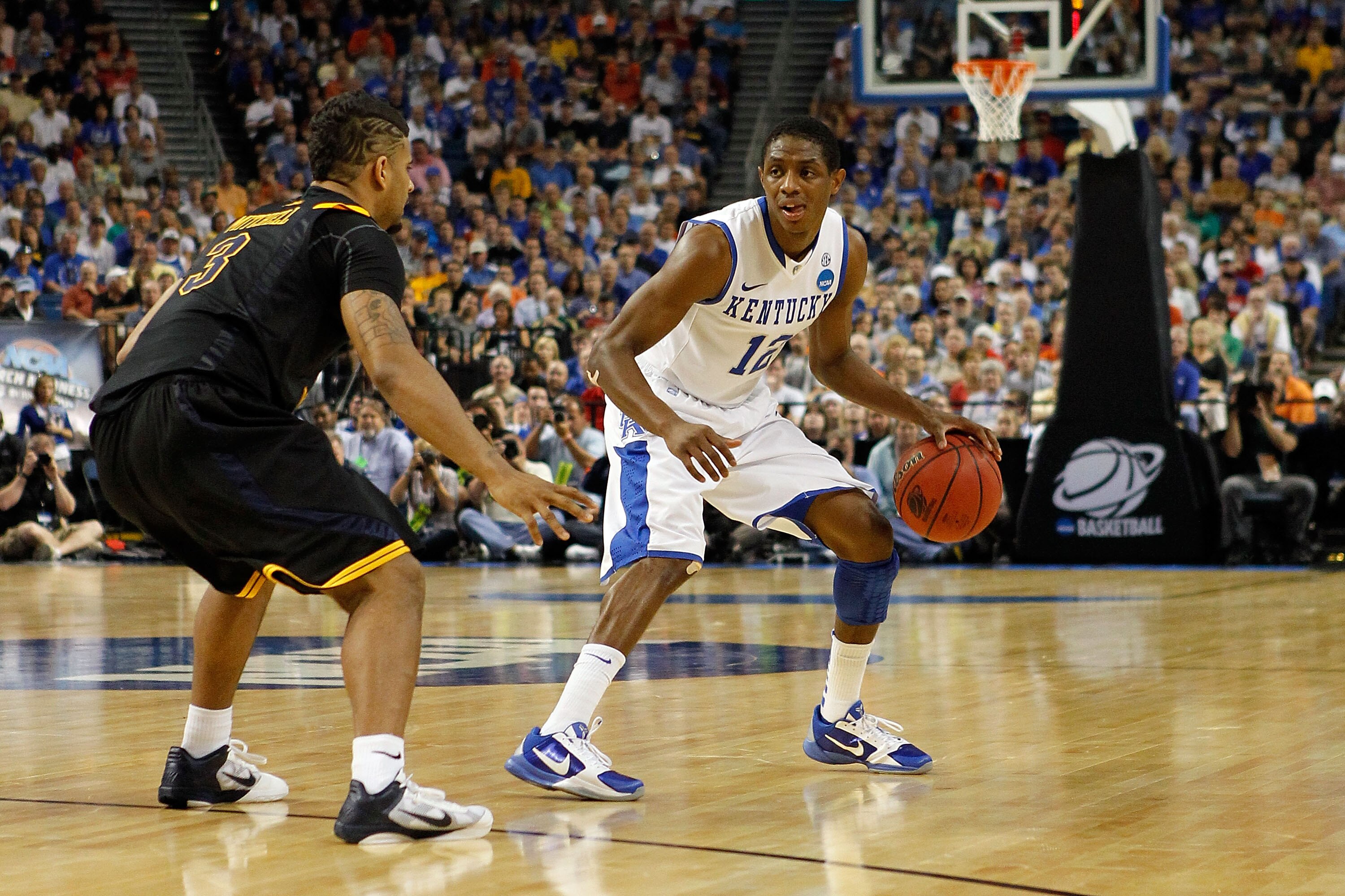 TAMPA, FL - MARCH 19:  Brandon Knight #12 of the Kentucky Wildcats looks to pass against Casey Mitchell #3 of the West Virginia Mountaineers during the third round of the 2011 NCAA men's basketball tournament at St. Pete Times Forum on March 19, 2011 in T
