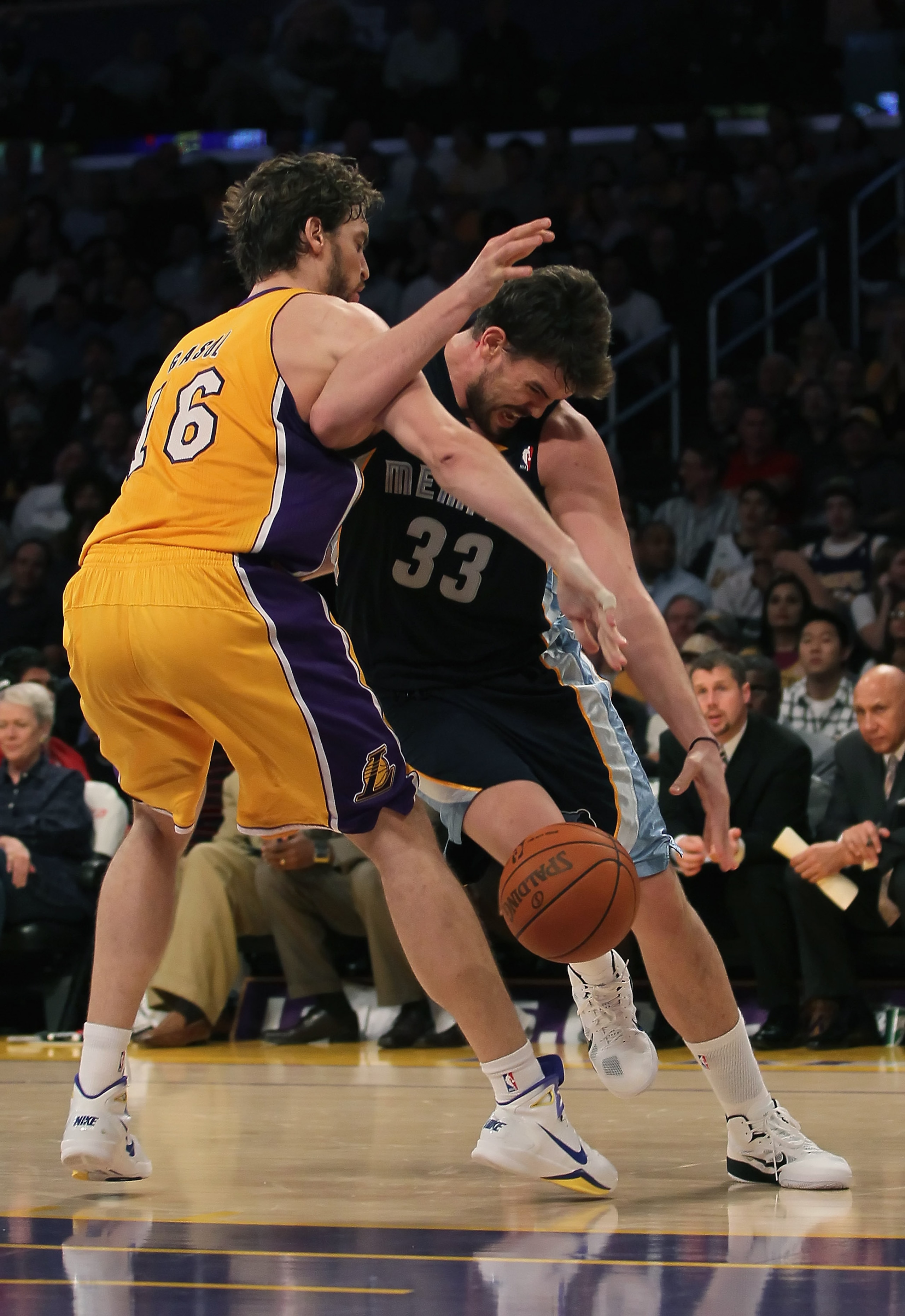 LOS ANGELES, CA - NOVEMBER 02:  Marc Gasol #33 of the Memphis Grizzlies is fouled by Pau Gasol #16 of the Los Angeles Lakers during the second quarter at Staples Center on November 2, 2010 in Los Angeles, California. The Lakers defeated the Grizzlies 124-